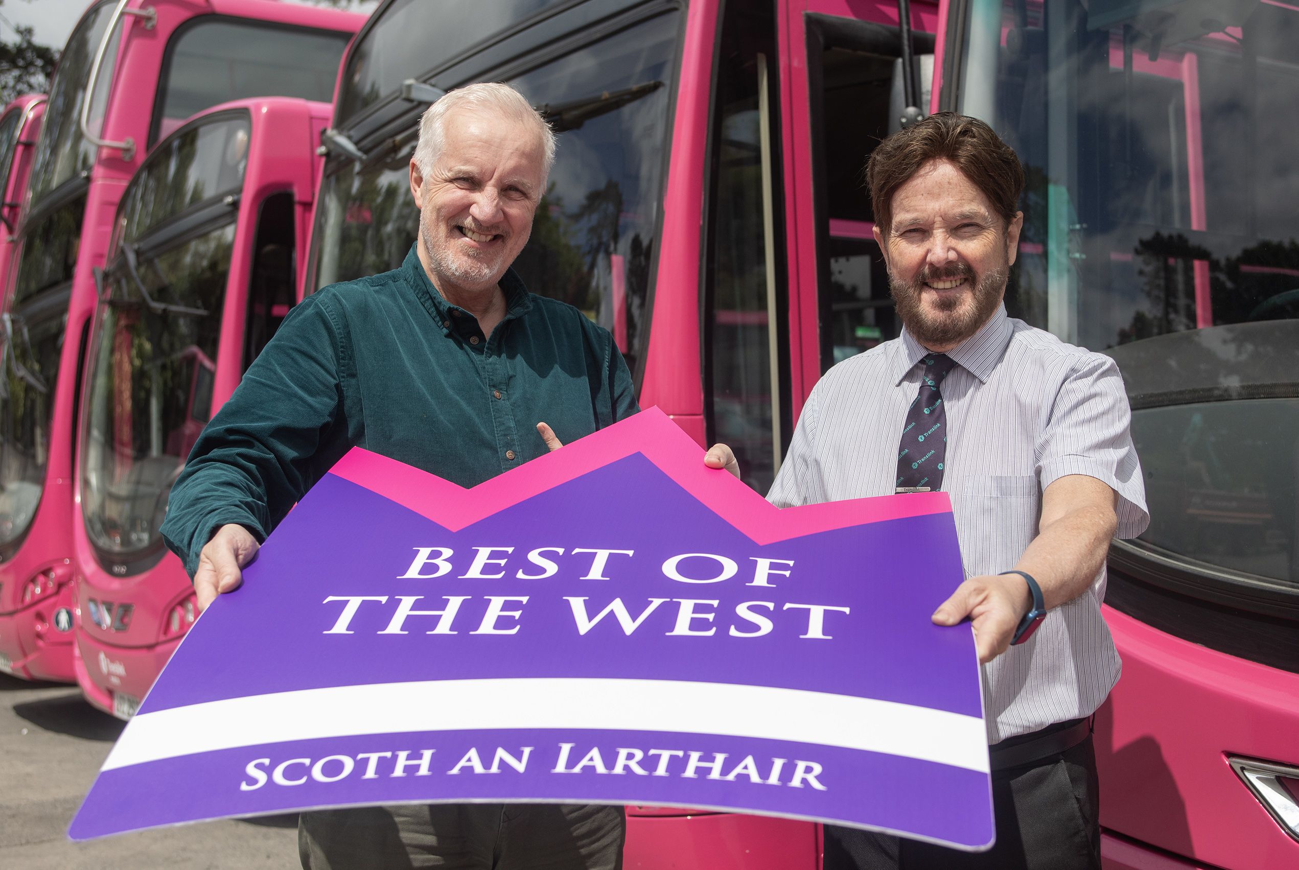 COMMUNITY SPIRIT: Translink Falls Depot manager Stephen Montgomery with group editor of the Belfast Media Group, Robin Livingstone 