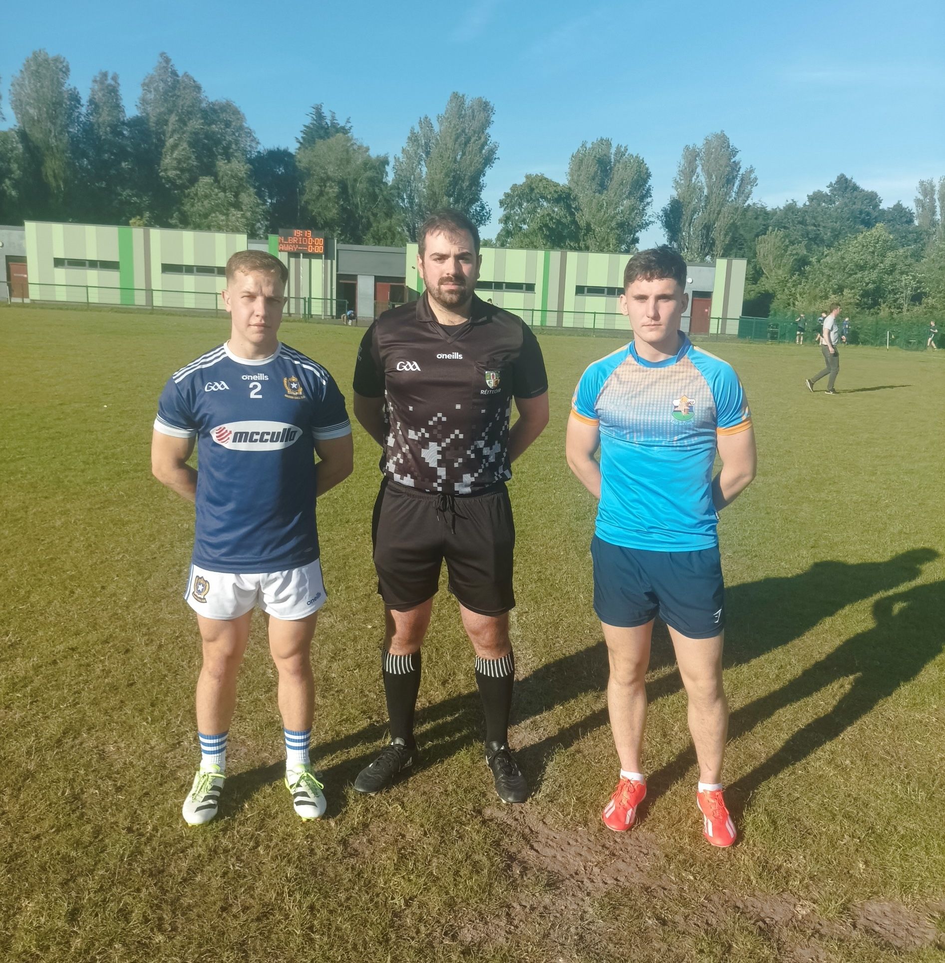 Marcus Donnelly and Ronan Boyle with referee Conall Roberts 