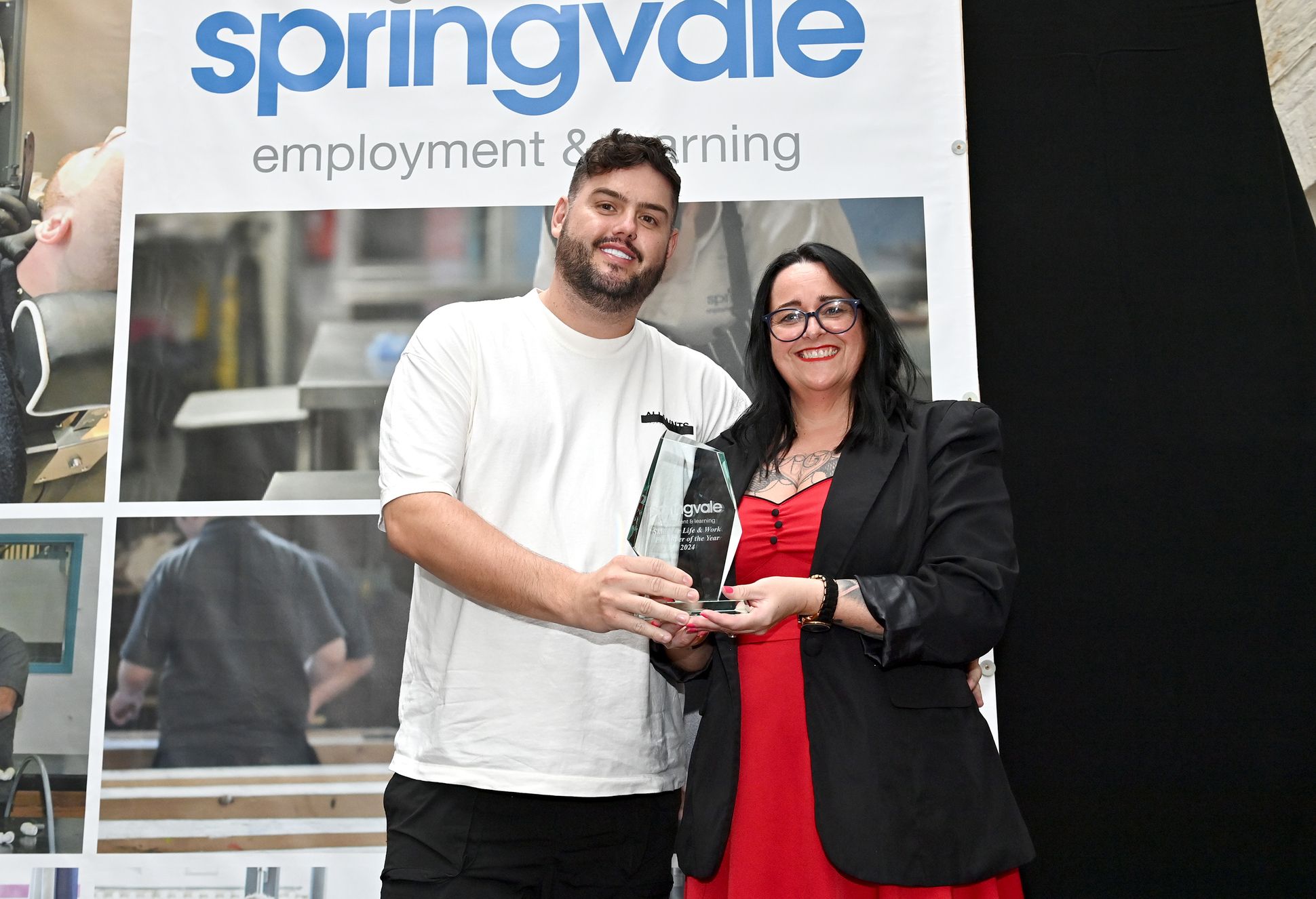 Sean Morgan, owner of the Hair Lounge is presented with his award for Skills for Life and Work employer of the Year  by Shelly Higgins (Programme Manager Springvale Learning)