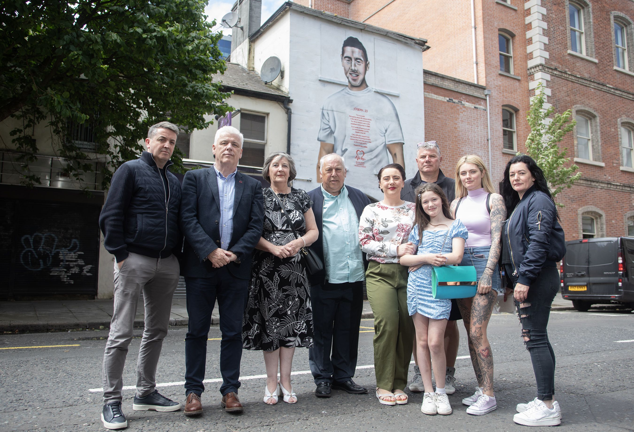 MURAL: The Burns family with Fearghal McKinney, Head of British Heart Foundation