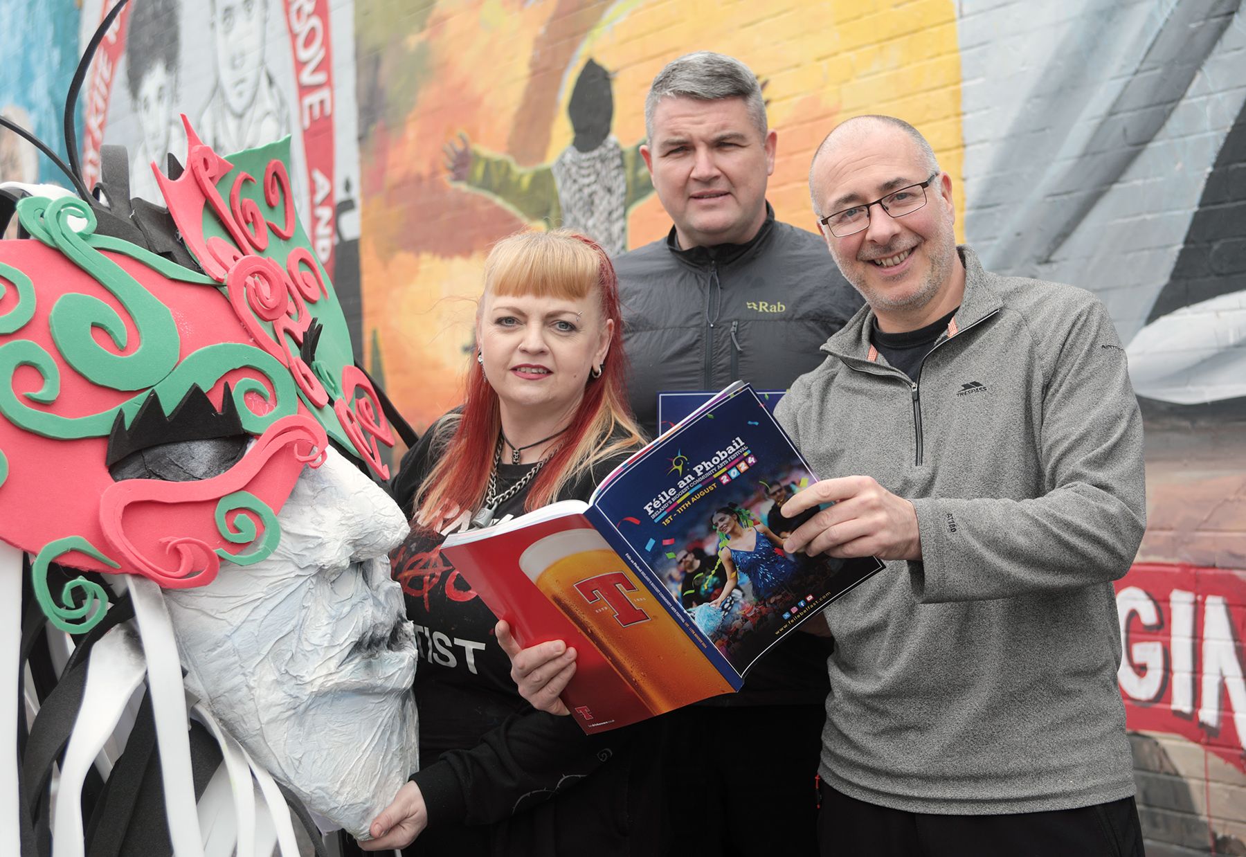 CARNIVAL PARADE: Margaret McCann (Carnival Chaos) with Joe Herald (Community Cohesion Manager) and Kevin Morrison (Community Engagement Manager) from Féile an Phobail