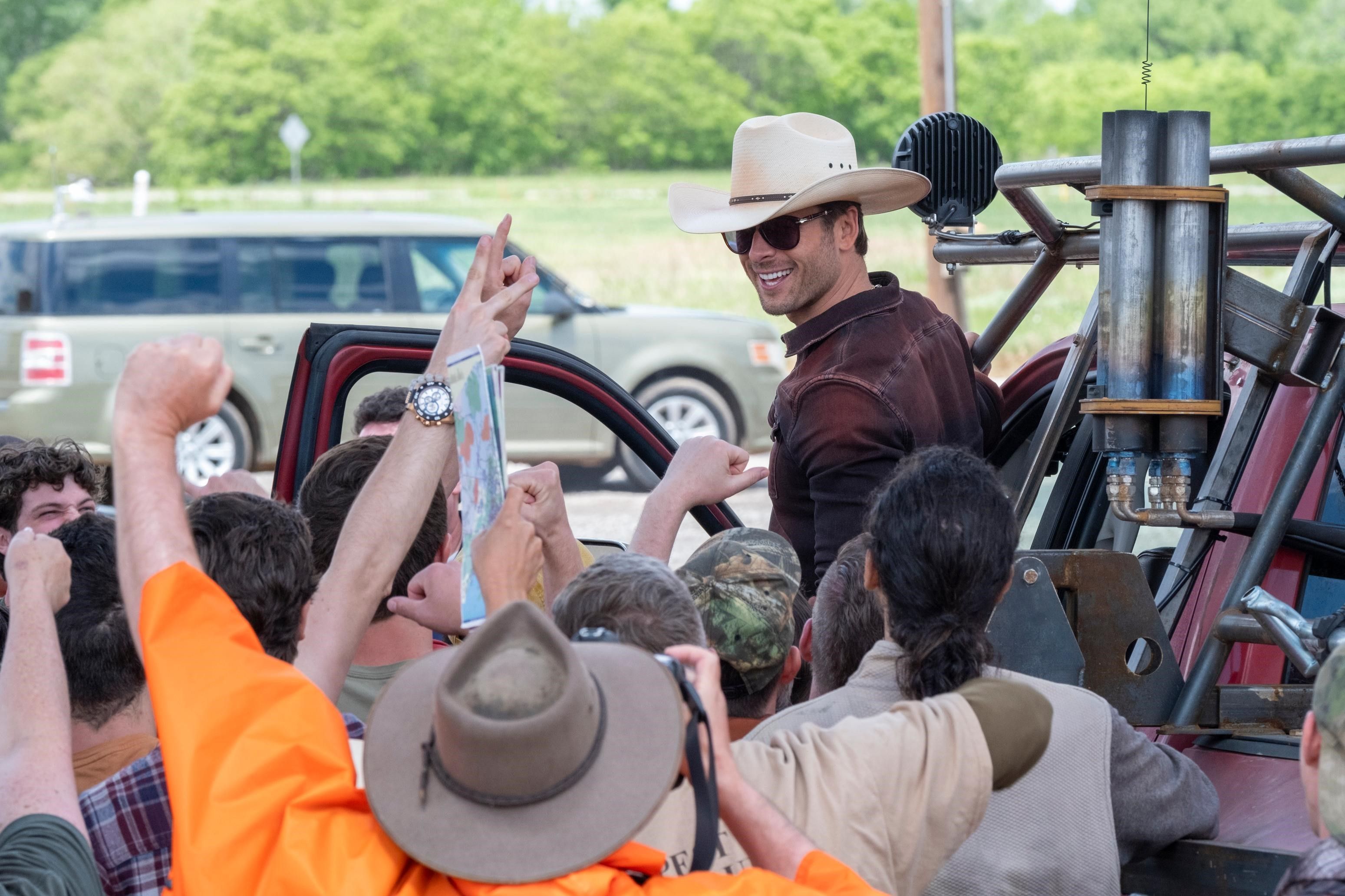 BLOWN-AWAY: Stetson-wearing ‘Tornado Wrangler’ (Glen Powell) is out to tame the twisters