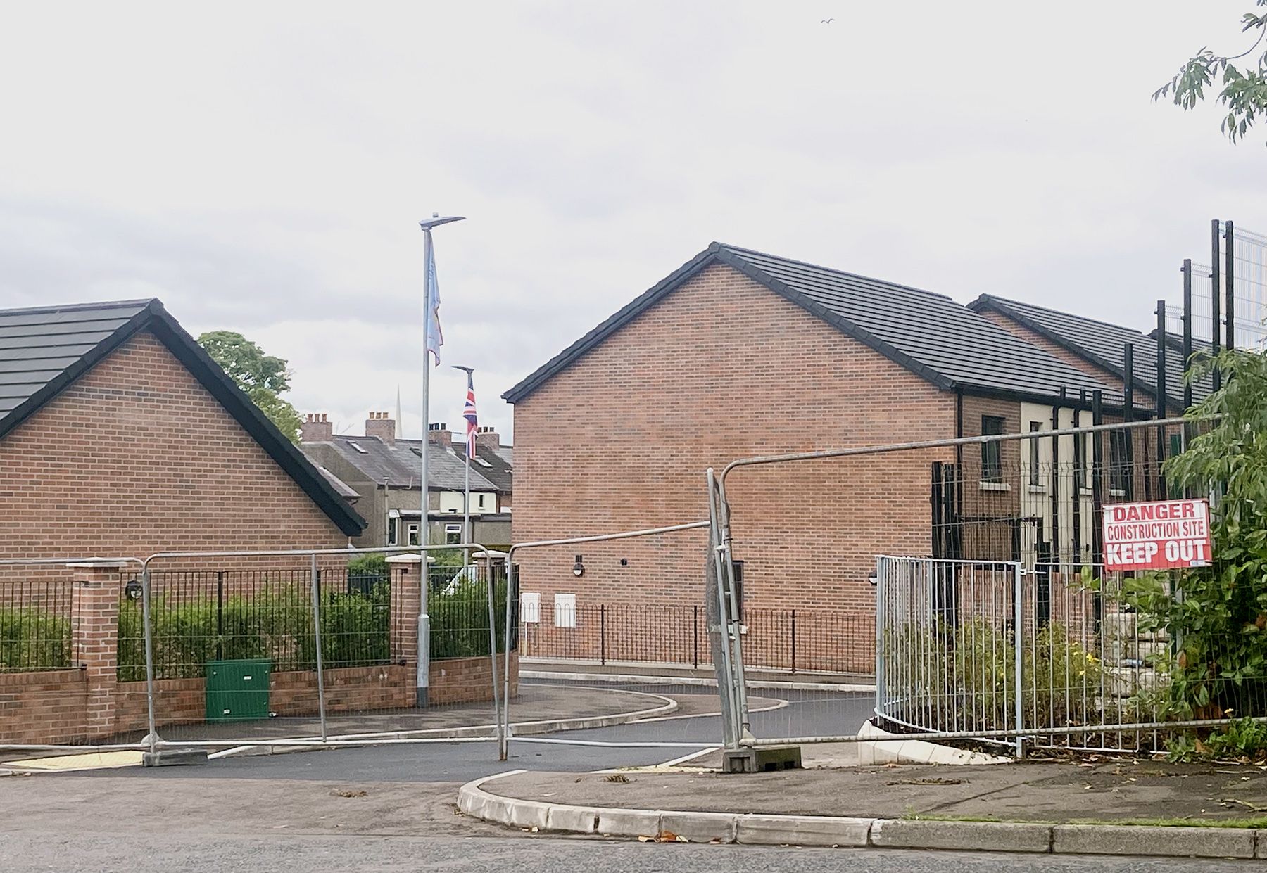 \"INTIMIDATION\": Loyalist paramilitary flags erected at new housing development in Gray\'s Lane