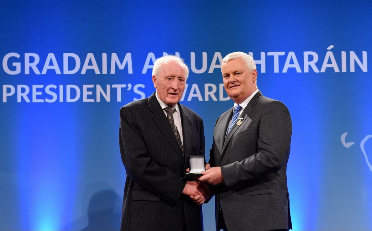 HONOURED: Seamus picking up his Gradam an Uachtaráin from then GAA President Aogán Ó Fearghail in 2018