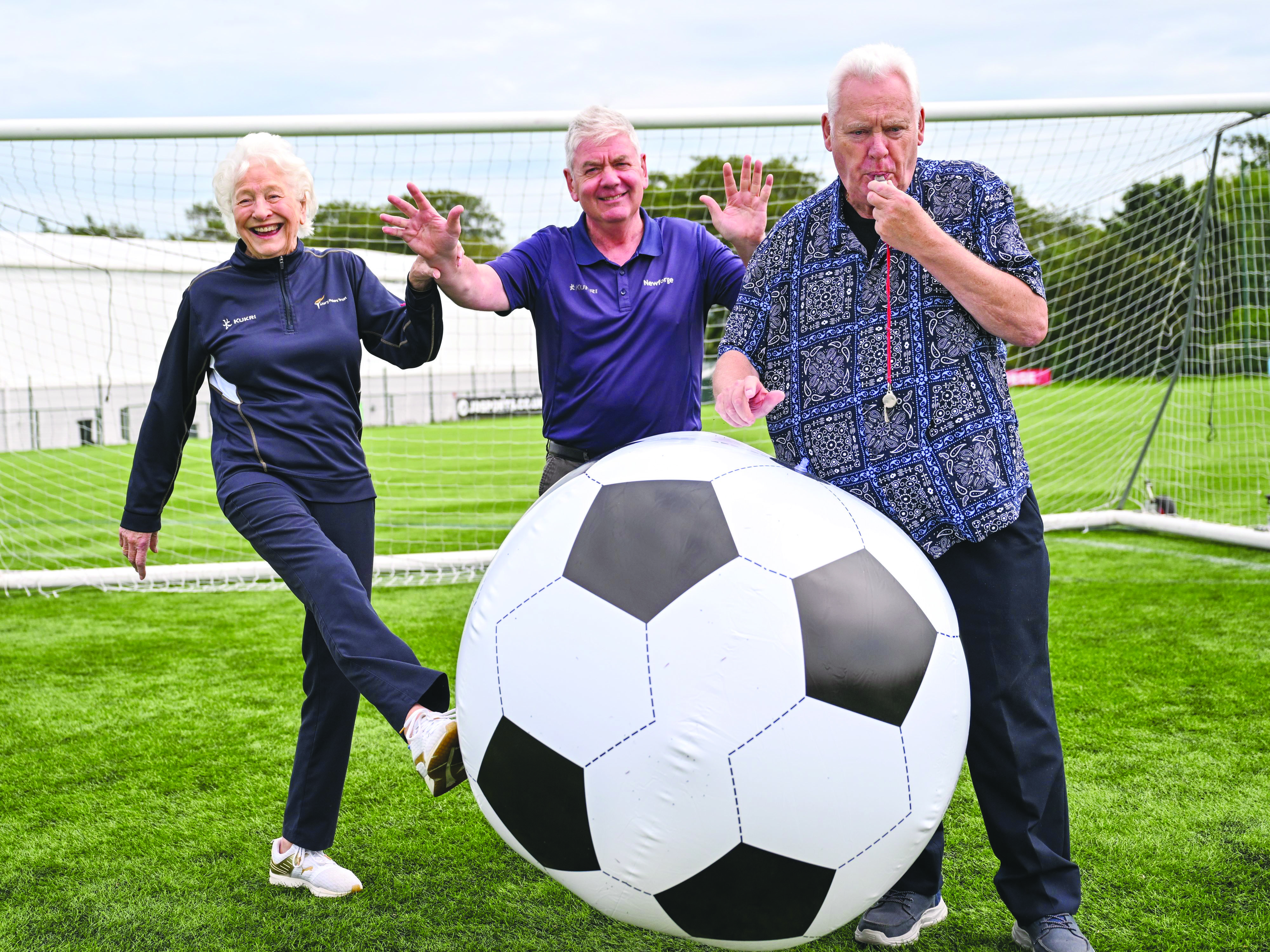 Lady Mary Peters (left) with Ivan Bell (right) and Alistair Magowan from Newforge Sports Complex.