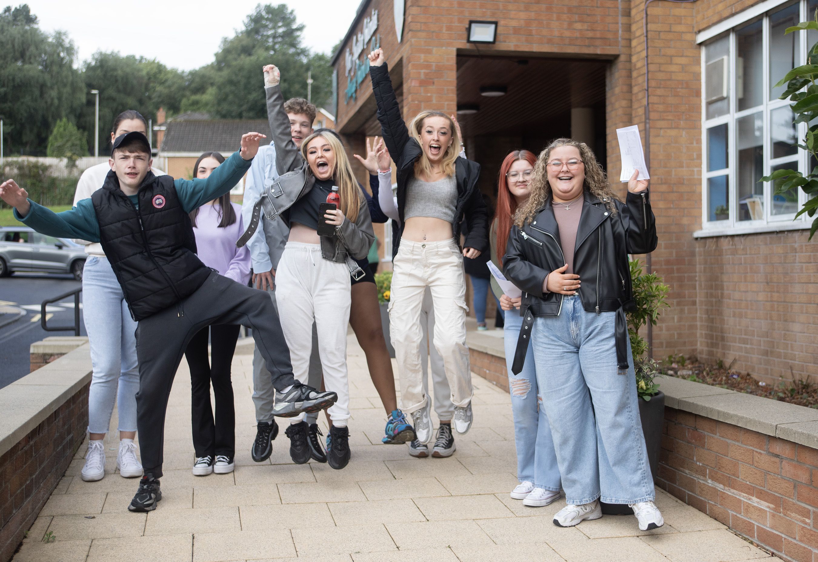 JOY: Pupils at St Louise\'s Comprehensive College celebrate after receiving their GCSE results on Thursday morning