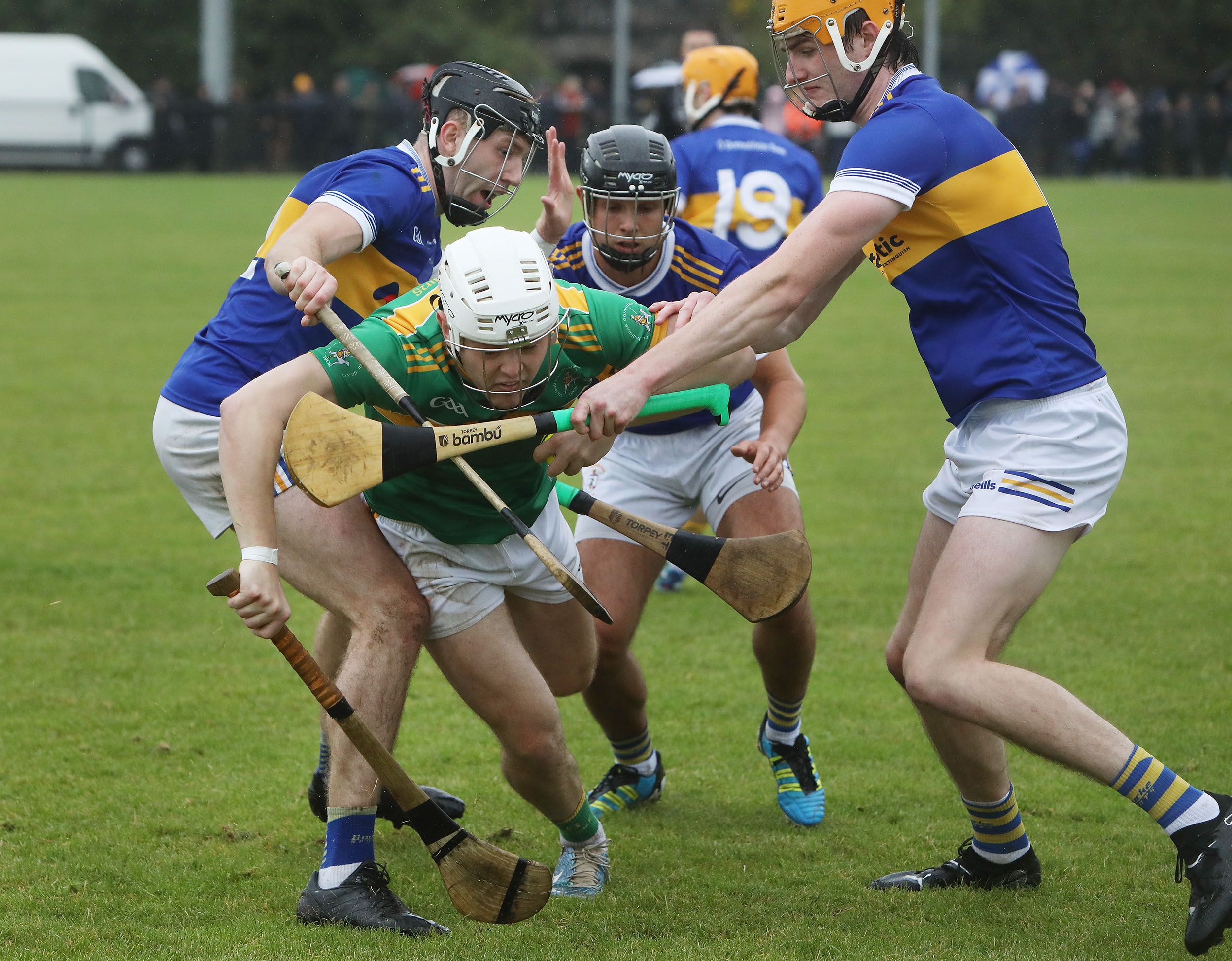 Dunloy\'s Ronan Molloy drives through the challenges of Aodhán O\'Brien, Eoin Trainor and Pearce Short on Sunday 