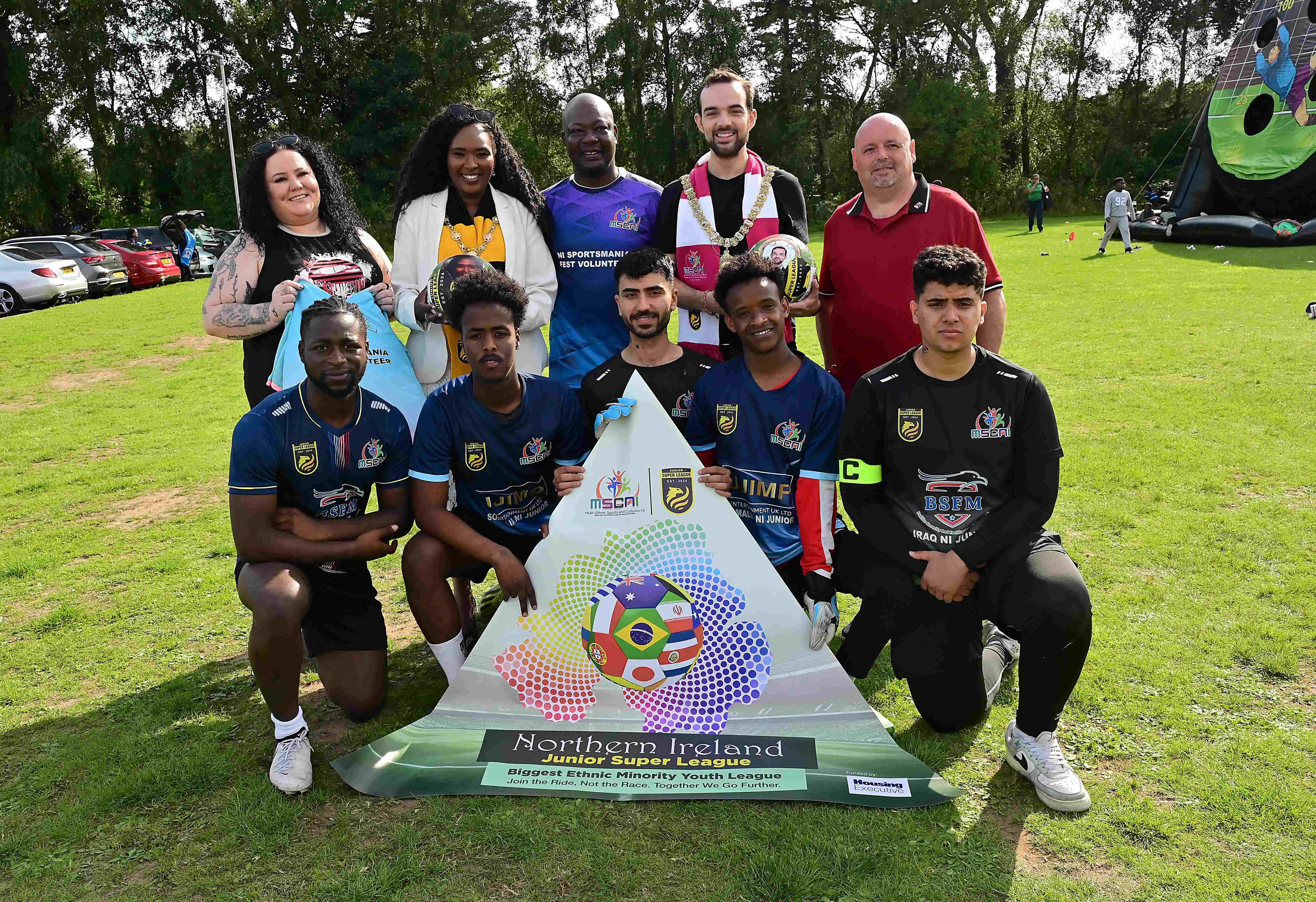 Lisa Hull, Housing Executive; Mayor of Derry and Strabane Lilian Seenoi-Barr; Jahswill Emmanuel BEM, Chairperson and Founder  MSCNI, Belfast Lord Mayor Micky Murray; Anthony Clarke, Housing Executive, and some of the players