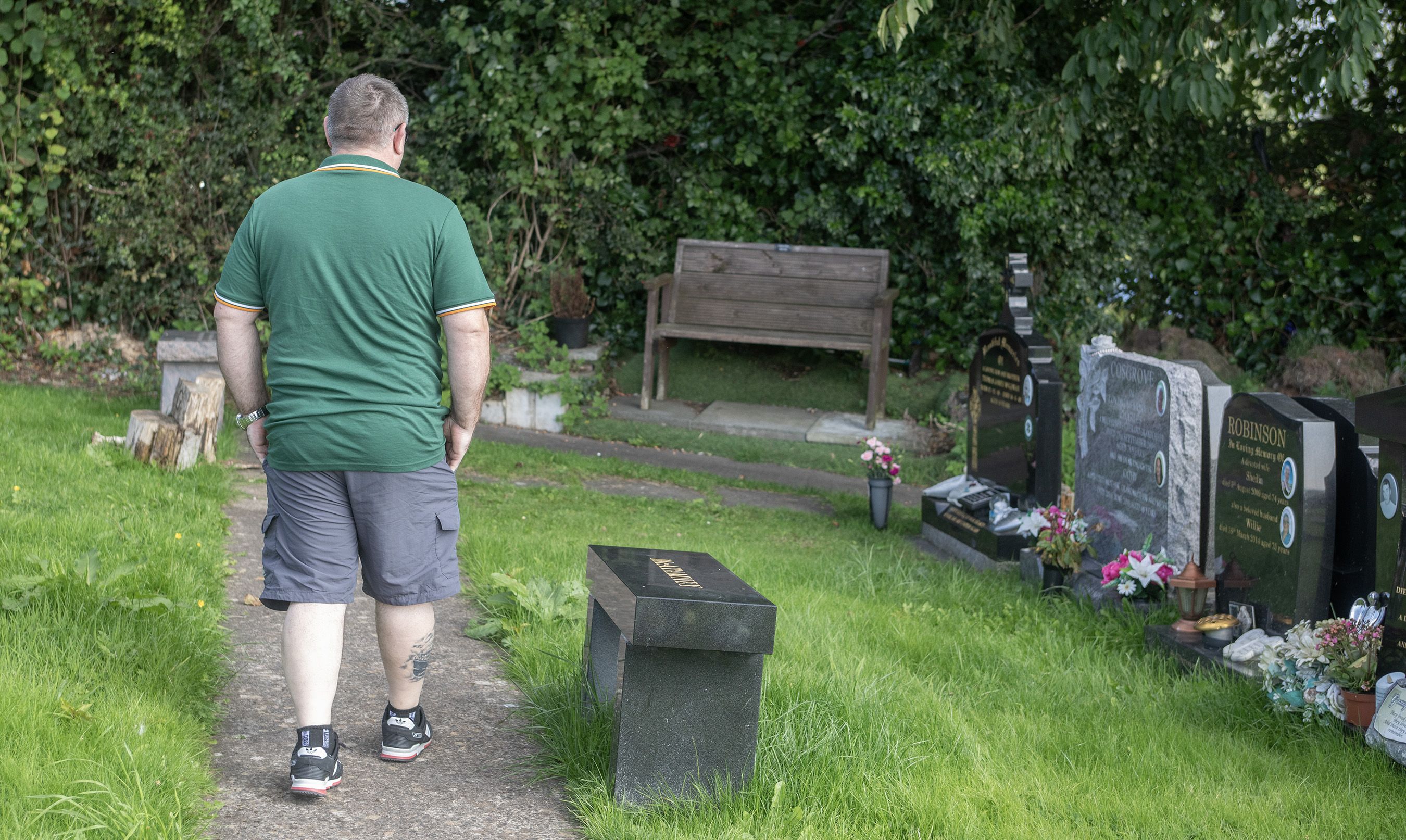 ANGER: Joe Gouldie at the grave of a family member where drugs paraphernalia has been found on several occasions