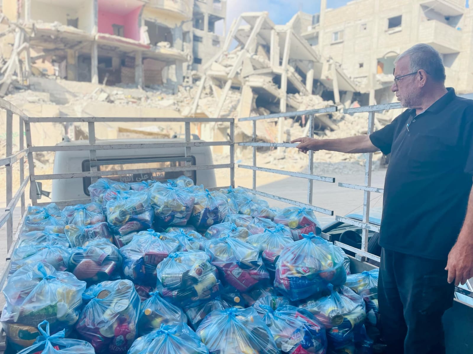 AID: A Palestine Aid Ireland volunteer in Gaza with food bought with money raised by the charity