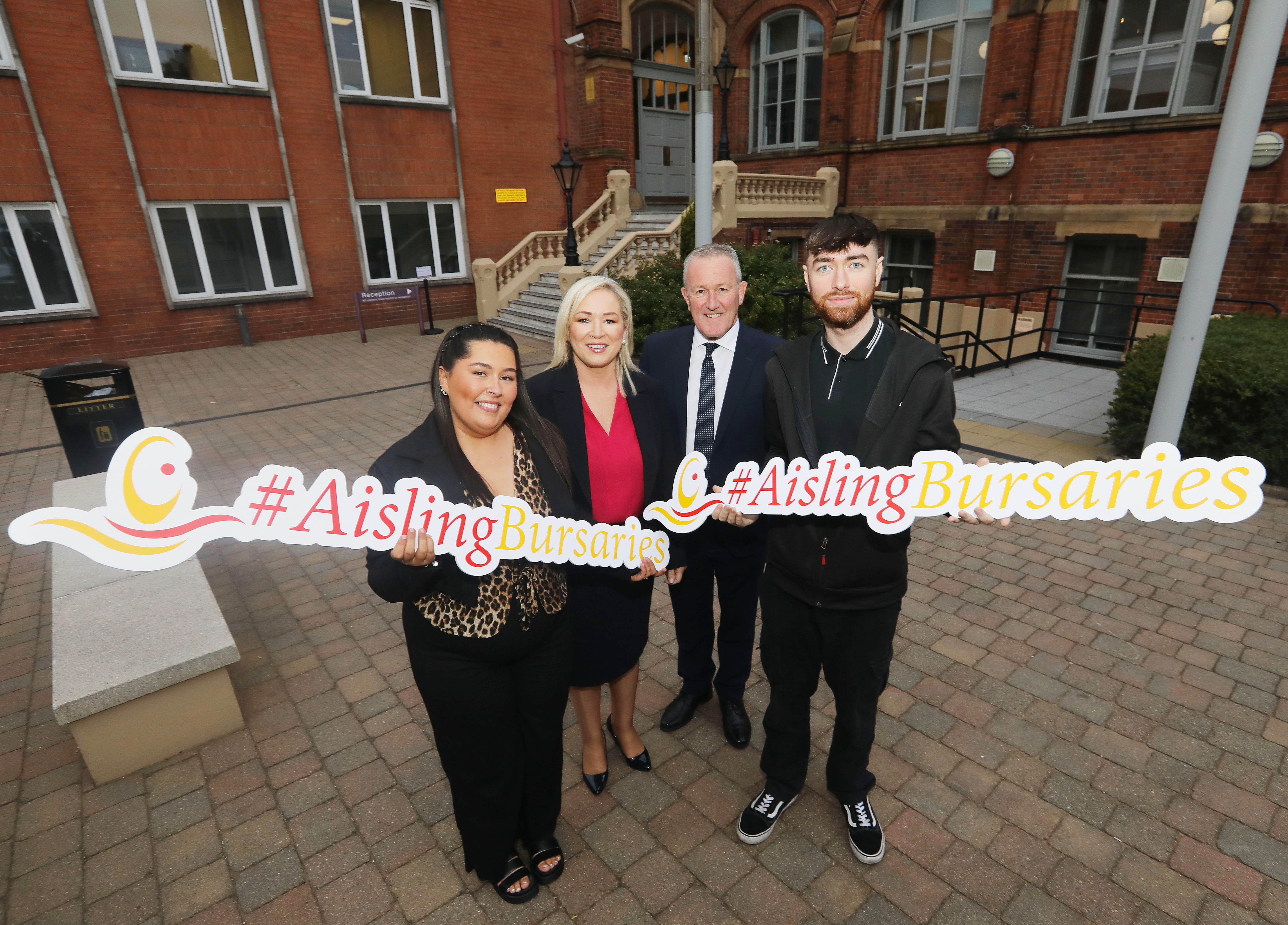 AMBITION: Aisling Bursary recipient Caitlin Callaghan, First Minister Michelle O’Neill MLA, Economy Minister Conor Murphy MLA, and Aisling Bursary recipient Padraig Davey at the Aisling Bursary ceremony at St Mary’s University College