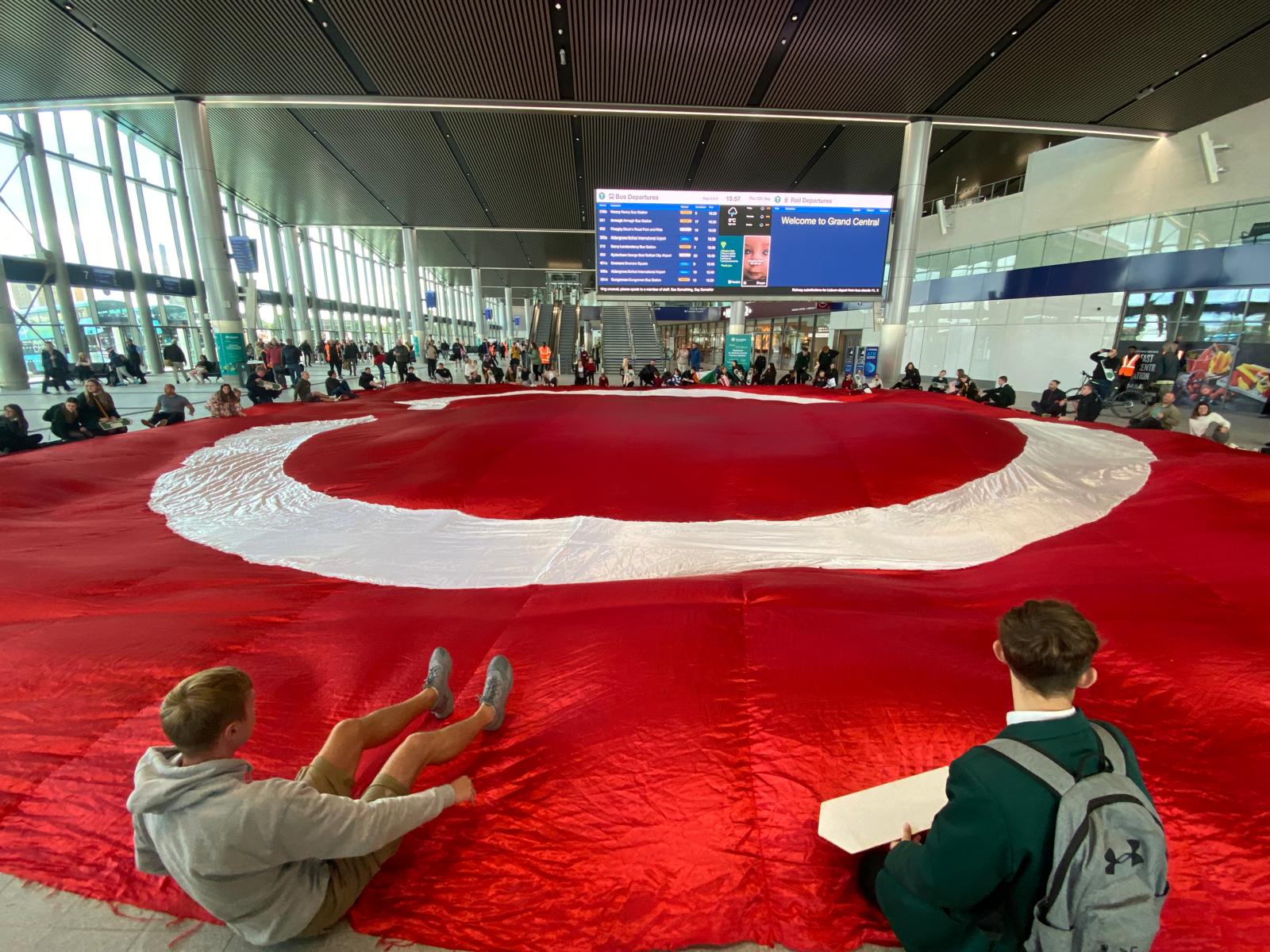 DEMAND: Irish language protesters have draped a huge Dream Dearg banner on the floor of the £350m new station