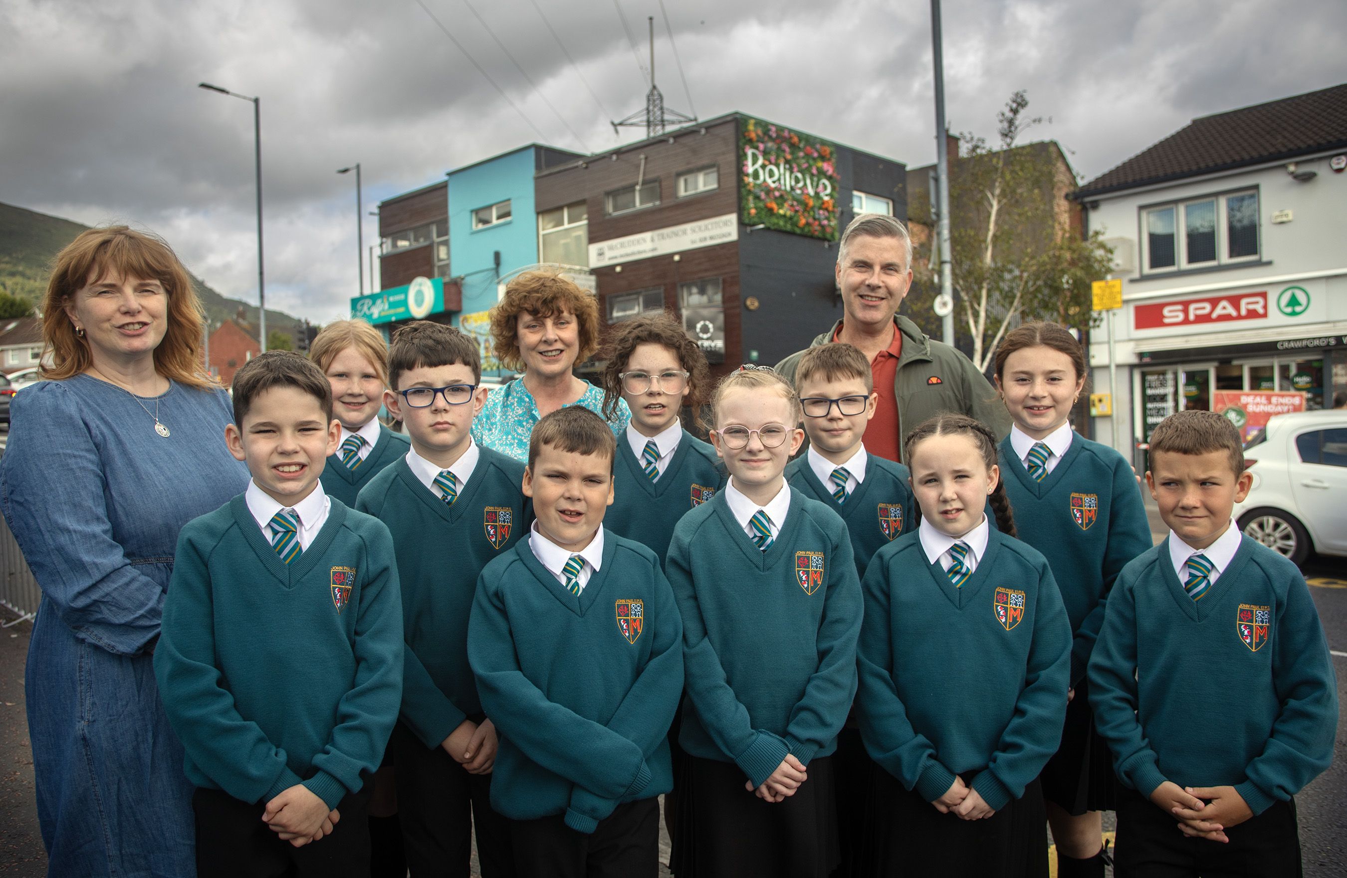 BELIEVE: Pupils from John Paul II Primary School with Steven Corr from Falls Community Council