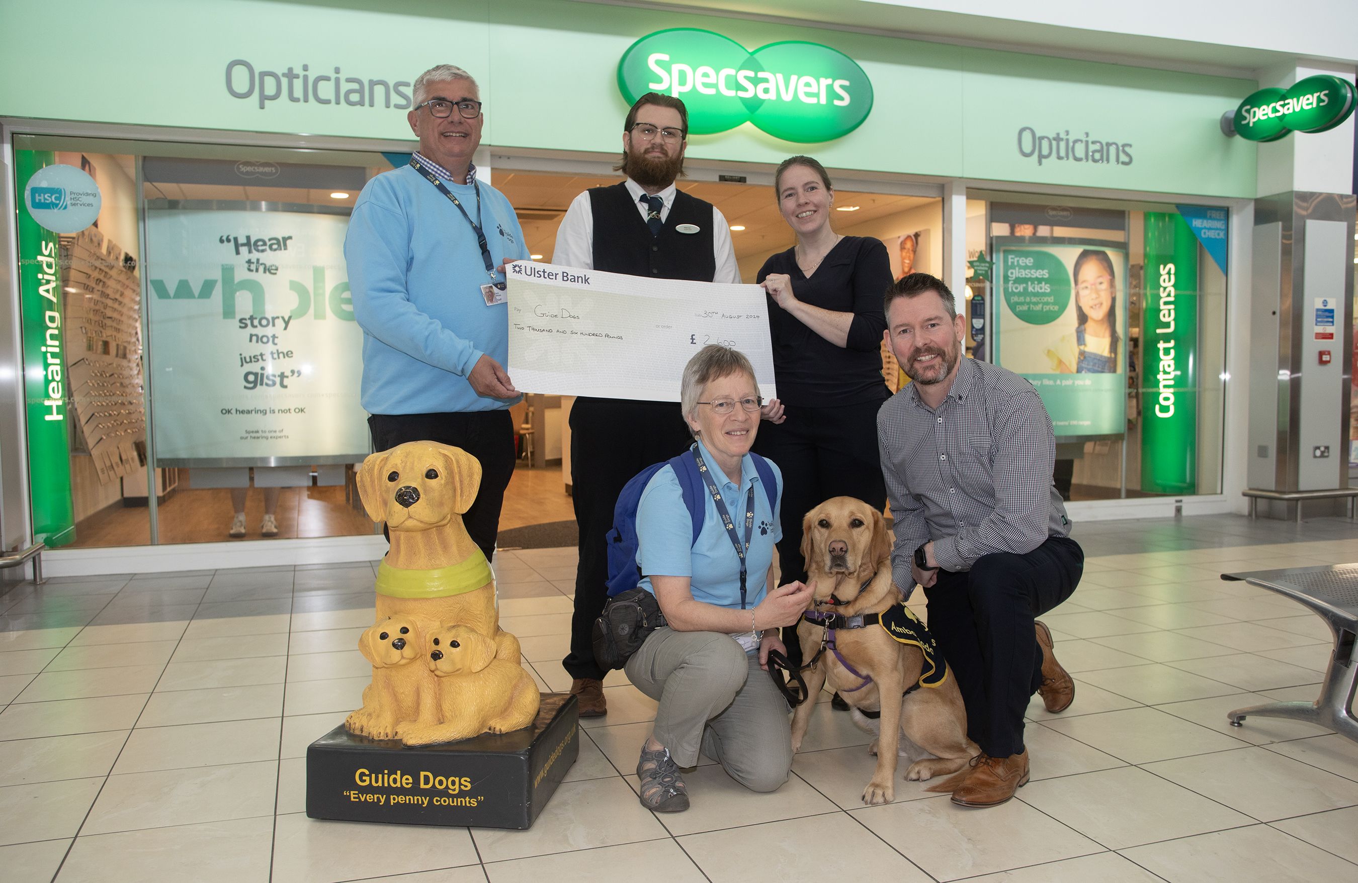 SUPPORT: Gary Wilson (Fundraising Manager for Guide Dogs Northern Ireland) and volunteer Christine Gordon with Specsavers Park Centre staff Dawn O’Neill, Marcus Gault, Jayne Martin and Matthew McKenny