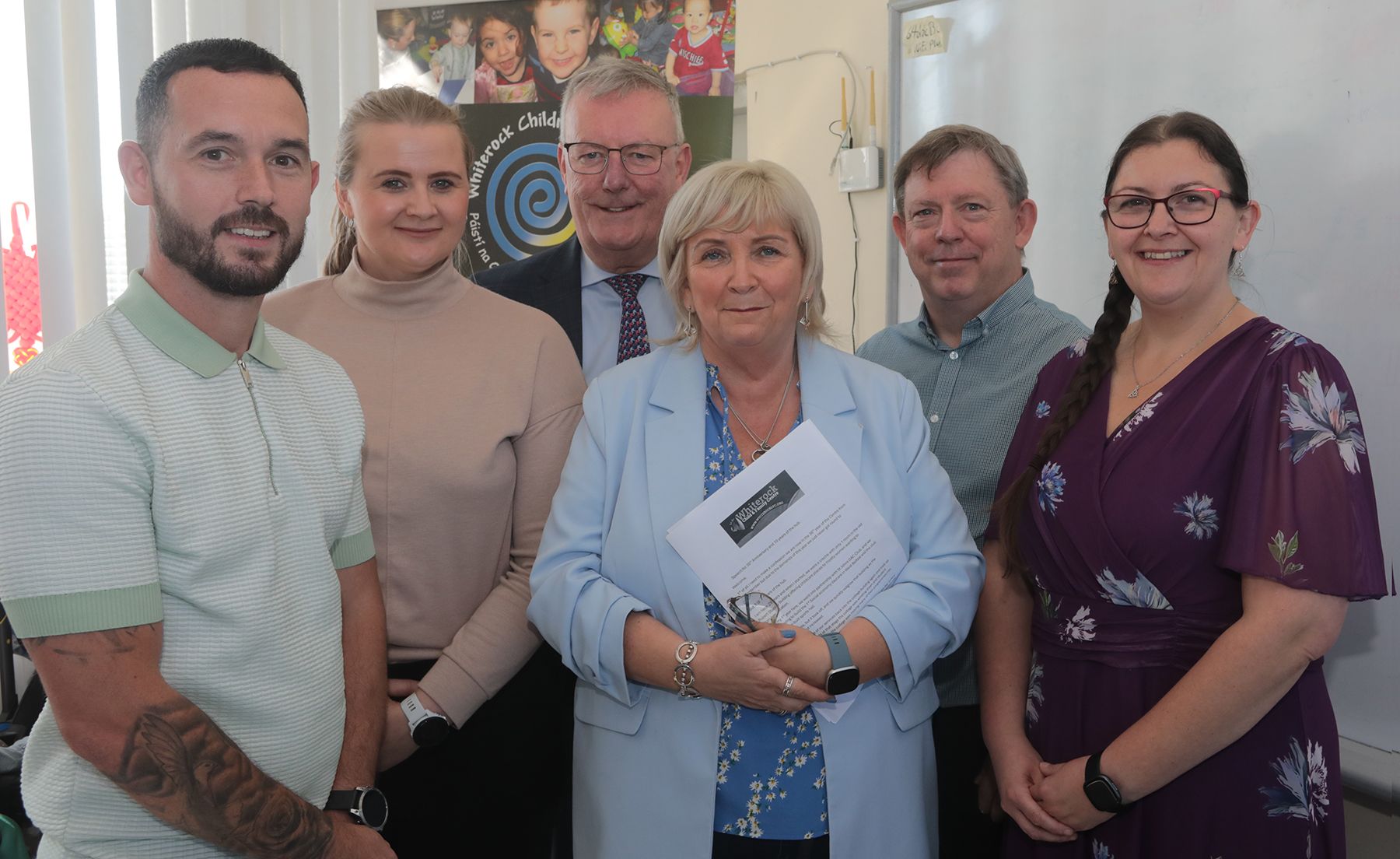 CELEBRATION: Michael Donelly (Upper Springfield Development Trust), Junior Minister Aisling Reilly MLA, Health Minister Mike Nesbitt MLA, Deirdre Walsh (Centre Director), Gerry Largey (Belfast HSCT) and Kate Lavery (Chairperson)