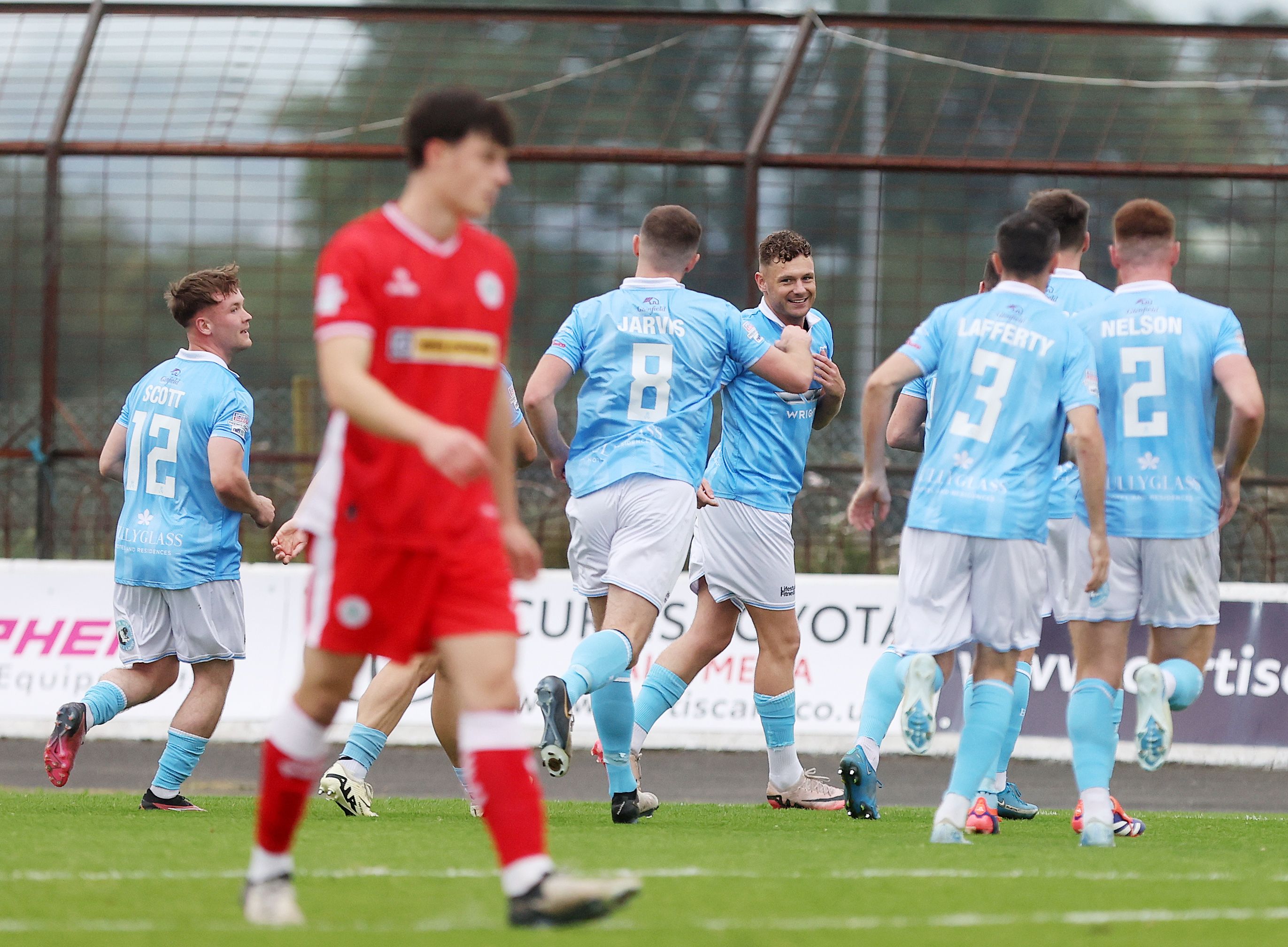 Ballymena United\'s players celebrate hitting the front on Saturday 