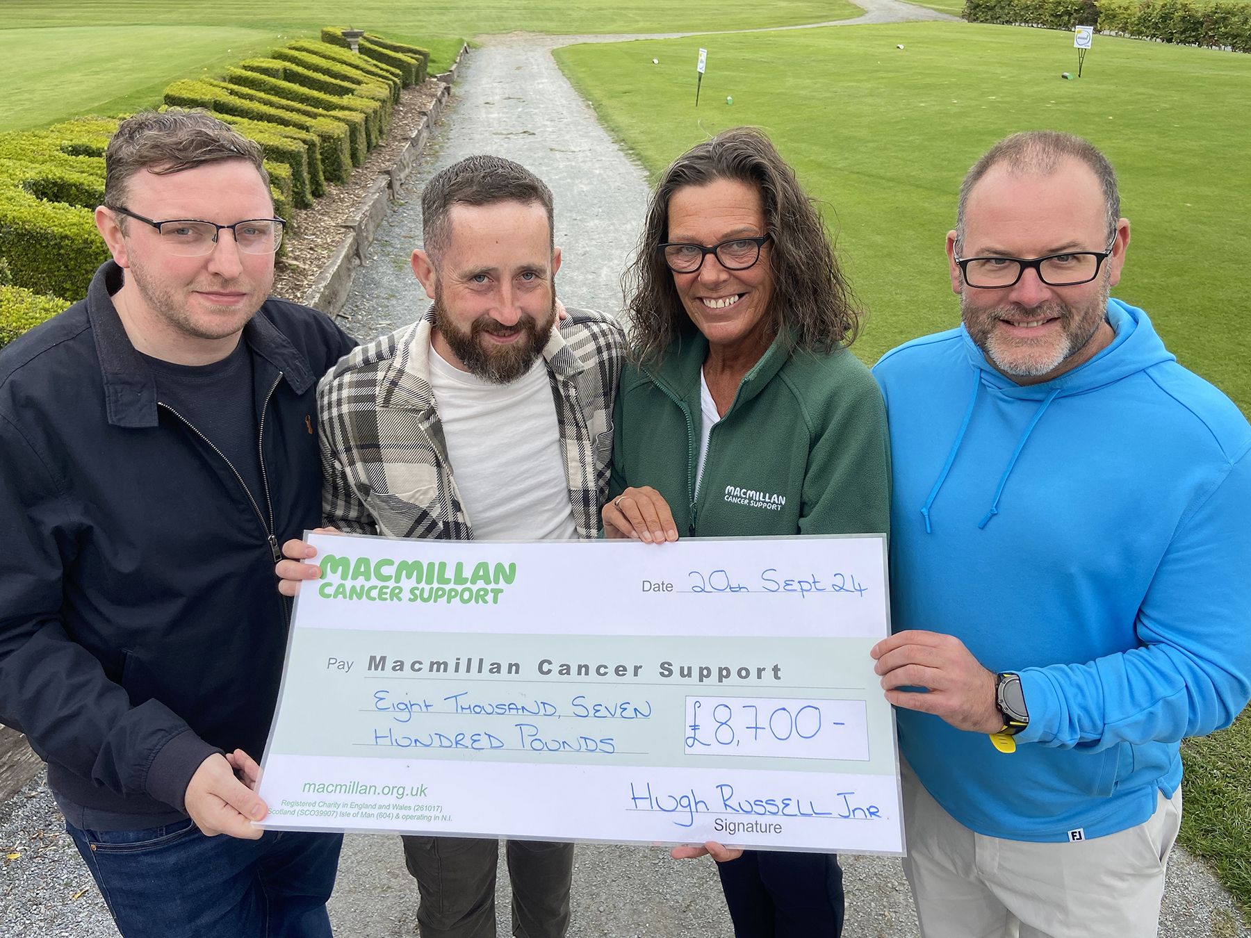 Hugh Russell Jnr (second left) with Aidan Braniff, Joanne Young and Ricky Duckett from MacMillan 