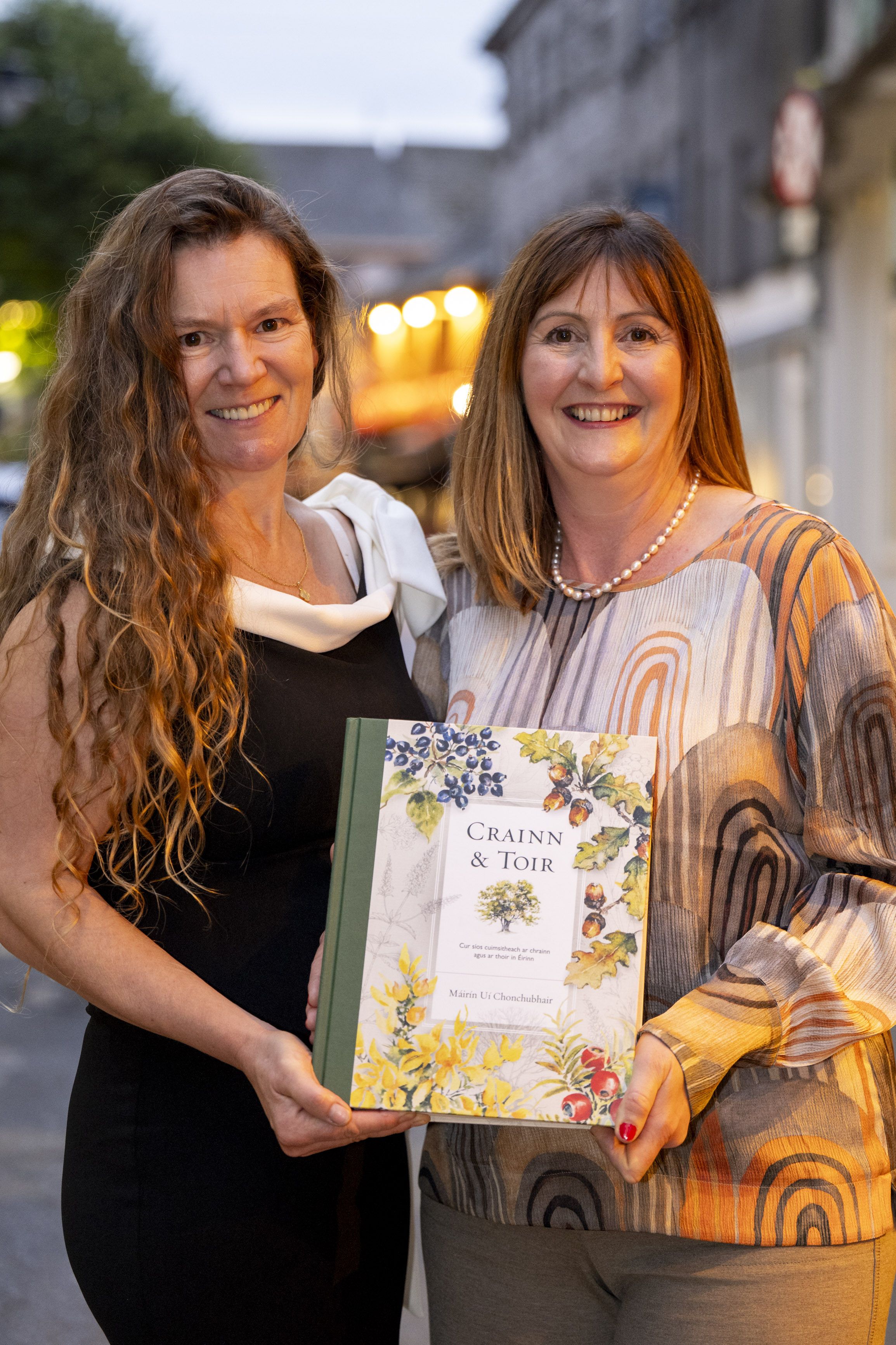 WINNER: Siobhán Prendergast, left, of Dingle Publishing Services, with Crainn & Toirr author\'s daughter Neasa Ní Chonchubhair