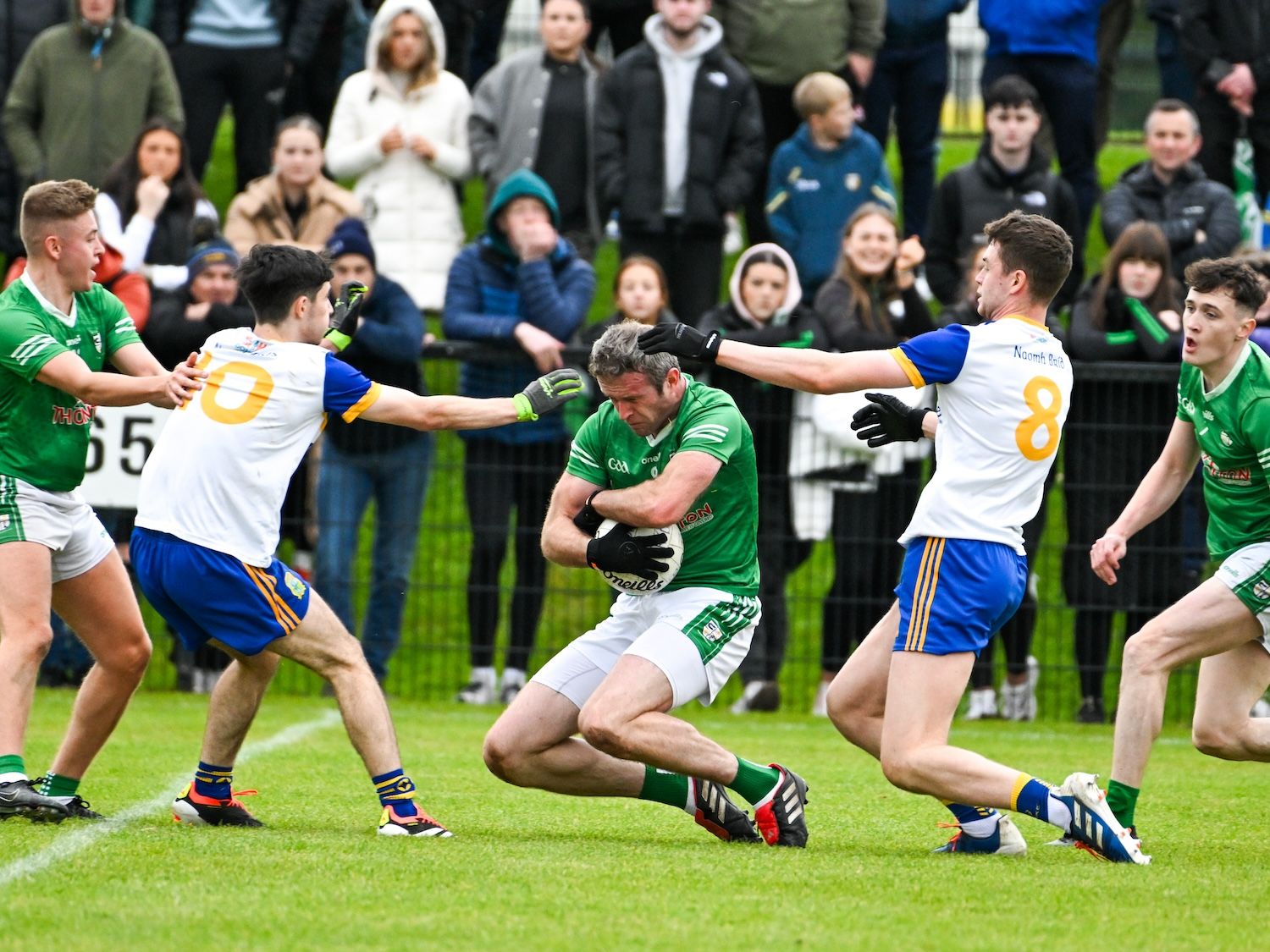 Gerard McCann gets to the ball ahead of Niall Dufy and Michael Cummings 