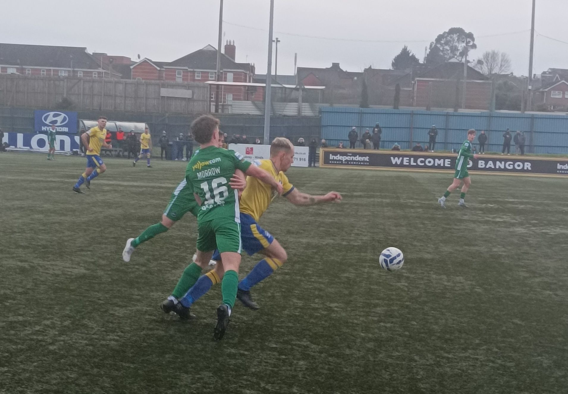 Bangor\'s Reece Neale is challenged by Robbie Morrow on Saturday 