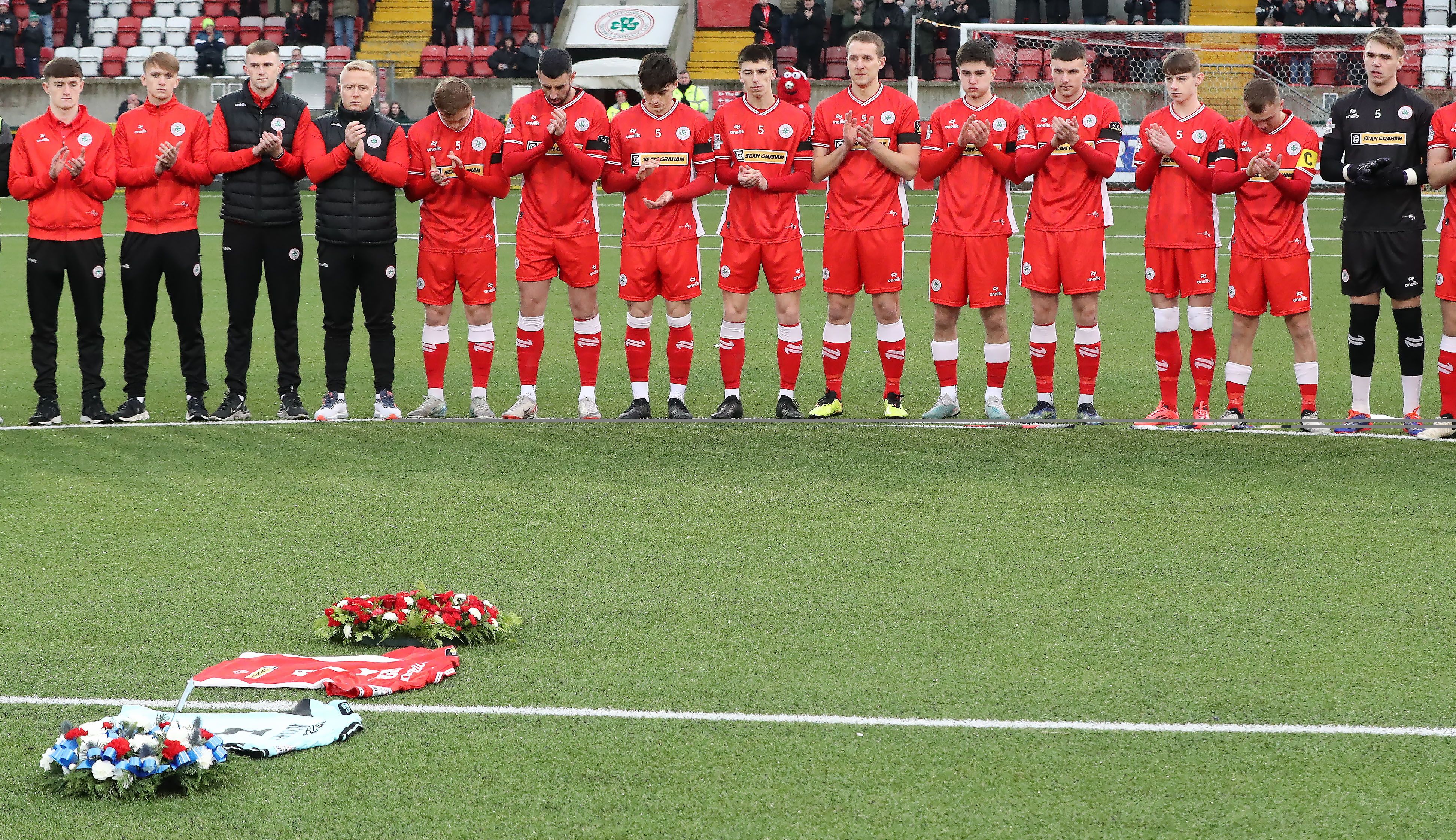 Cliftonville players, all wearing the late Michael Newberry\'s number 5 on the front of their jerseys, led a aminute\'s applause in honour of their team-mate ahead of Saturday\'s game 