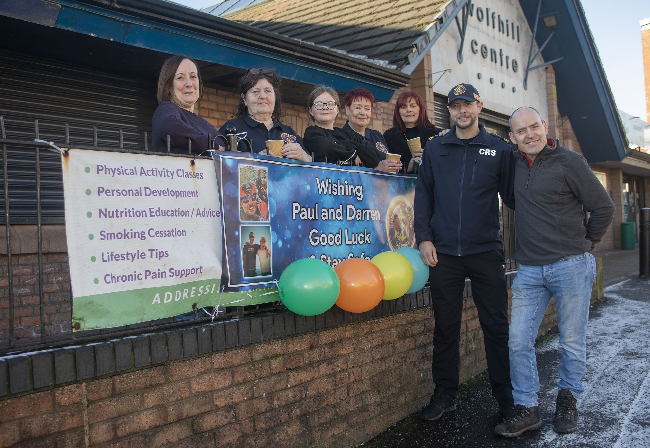 FUNDRAISER: Darren Harper and Paul Stitt with family and friends at the coffee morning fundraiser at the Wolfhill Centre in Ligoniel 