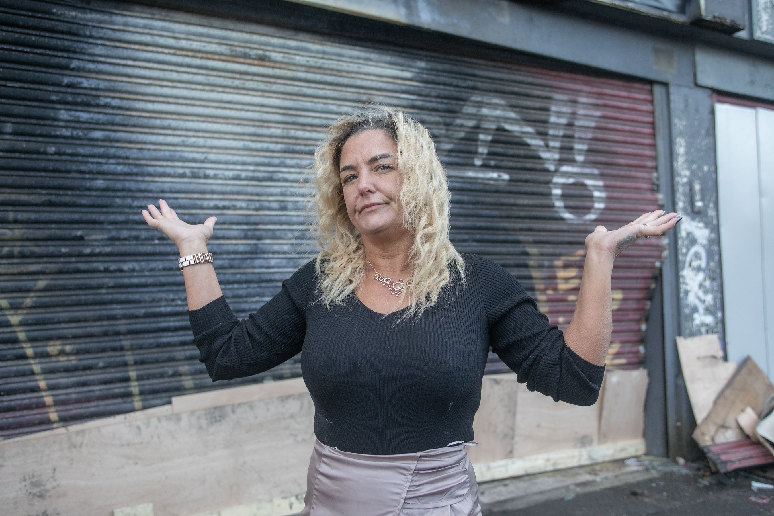 DEVASTATED: Deborah Kane outside her destroyed business in North Street