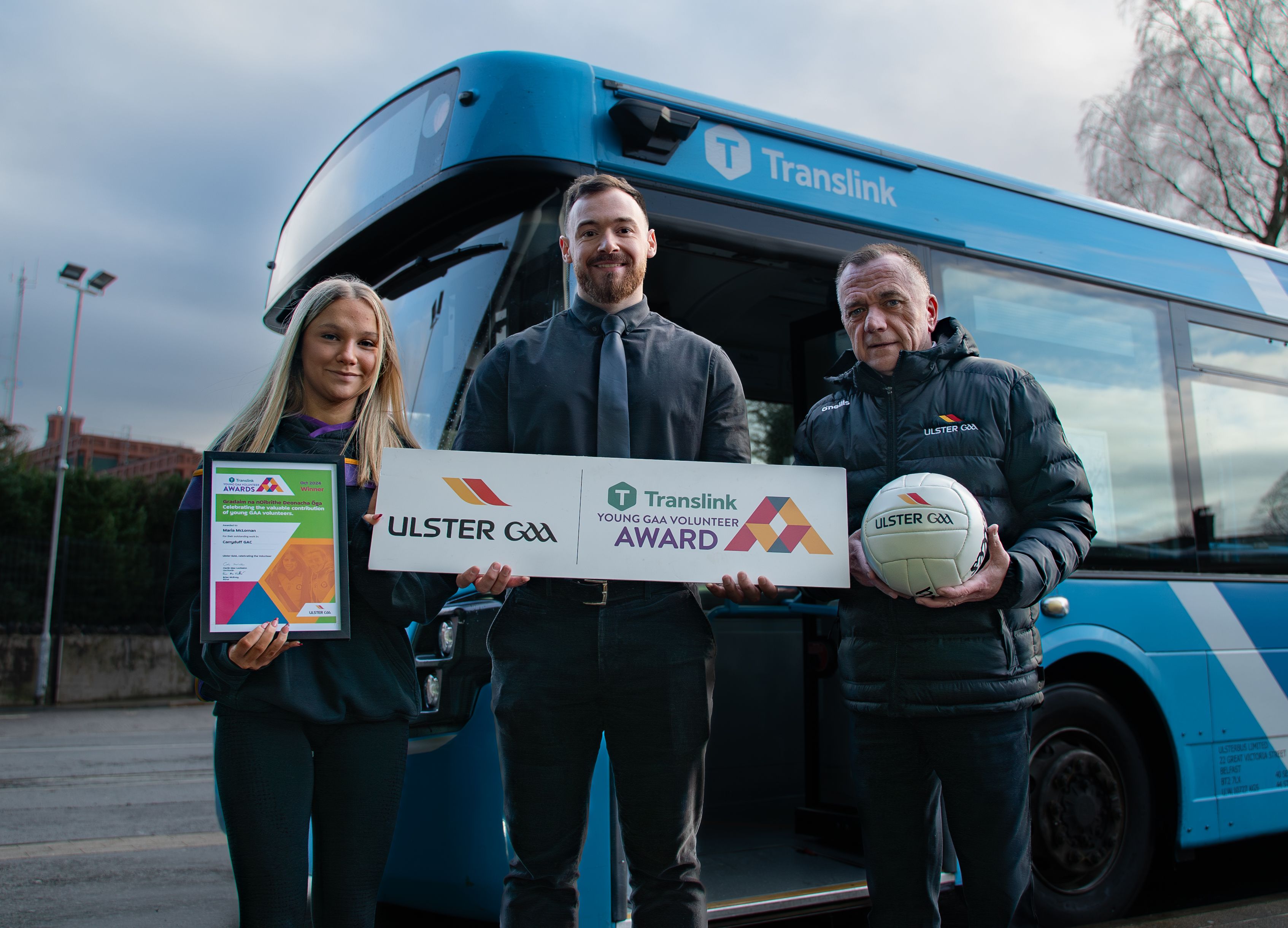 Translink Ulster GAA Young Volunteer of the Month Award winner for October 2024, Maria McLornan from Carryduff GAC, pictured with Paul Loughran, Translink, and Michael McArdle, Ulster GAA Public Relations Officer. 