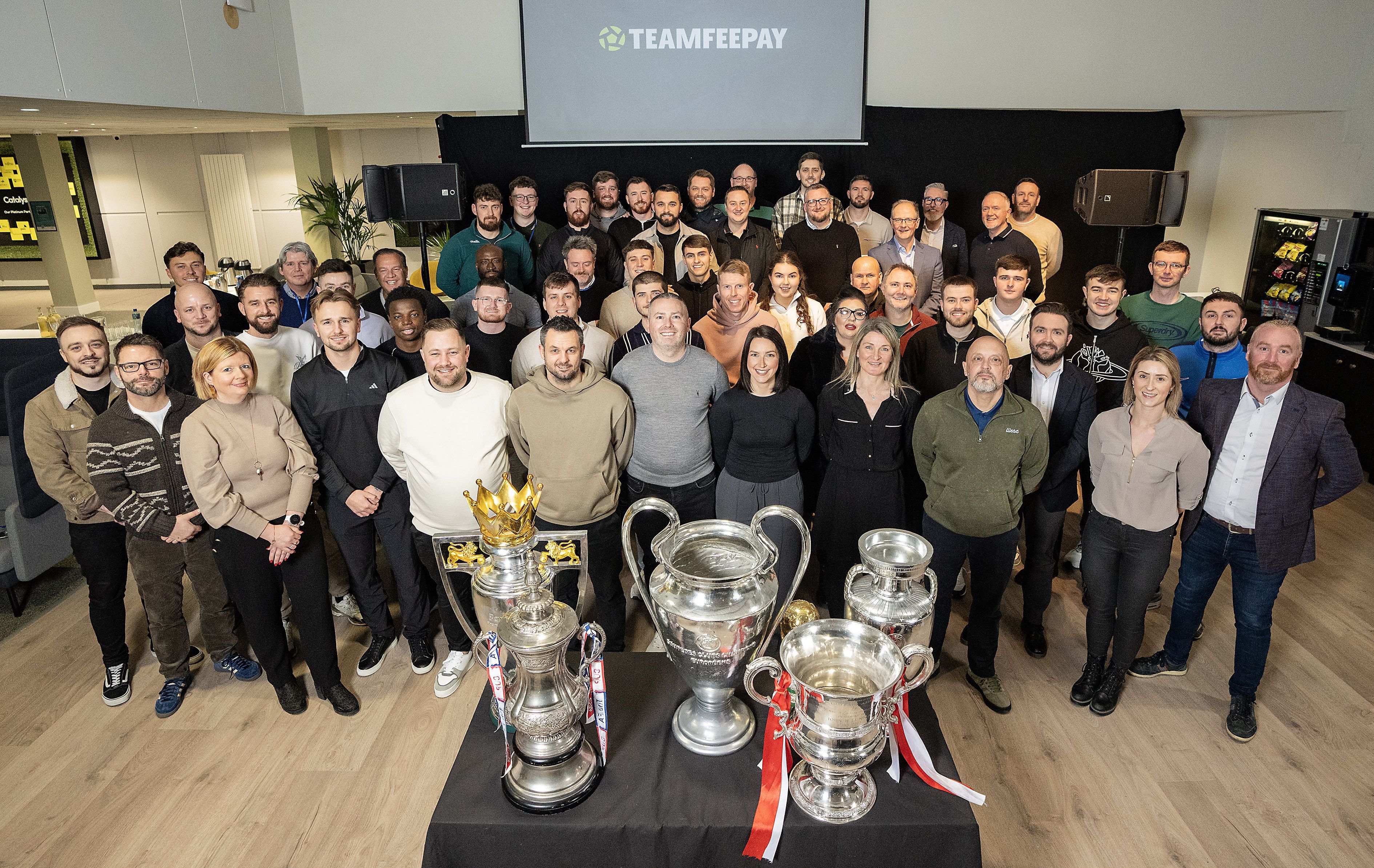 TEAMWORK: The TeamFeePay staff and guest at last week\'s celebration in the Titanic Quarter