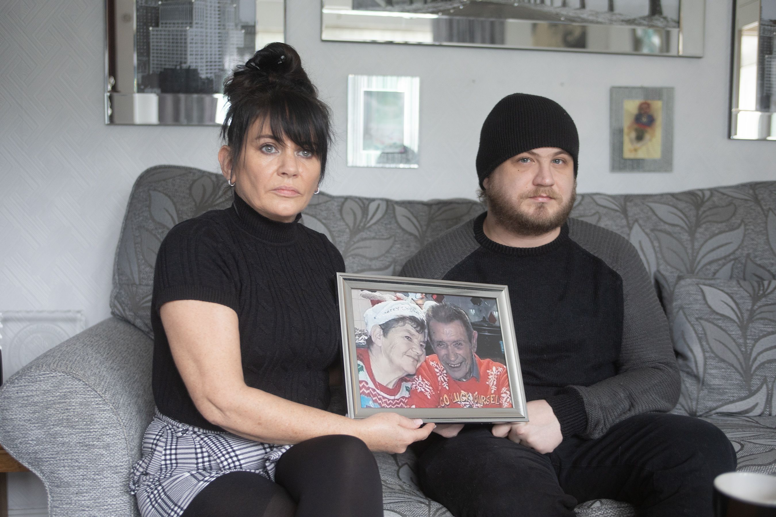 FAMILY HOME: Caroline Reid and son Marc with a photo of Winnie and Harry