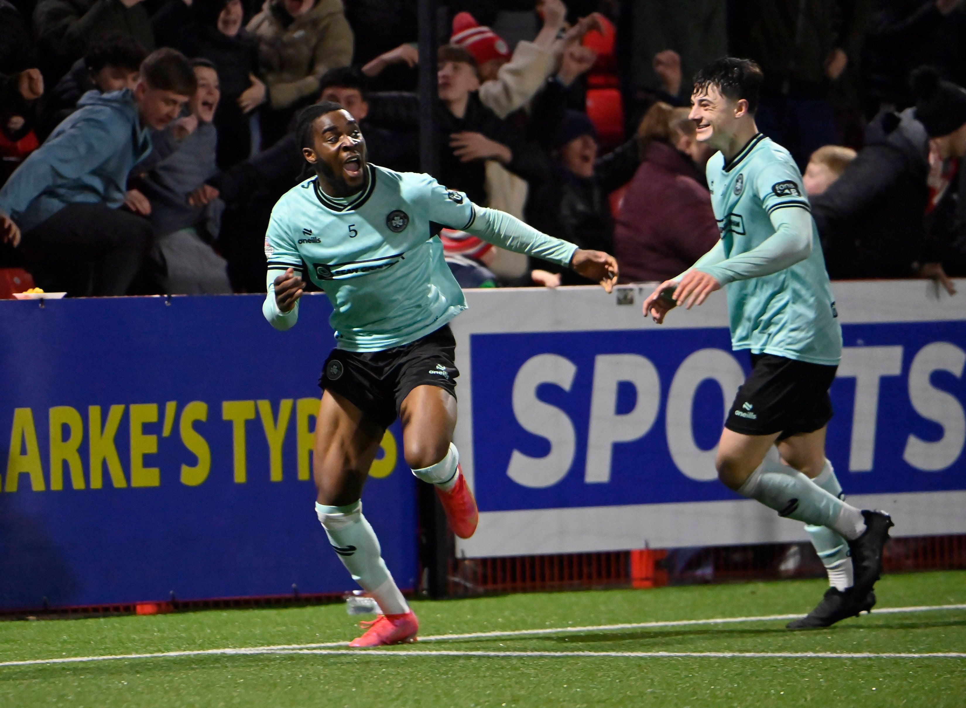 Destiny Ojo runs to the Cliftonville support after scoring what proved to be the winner in extra-time