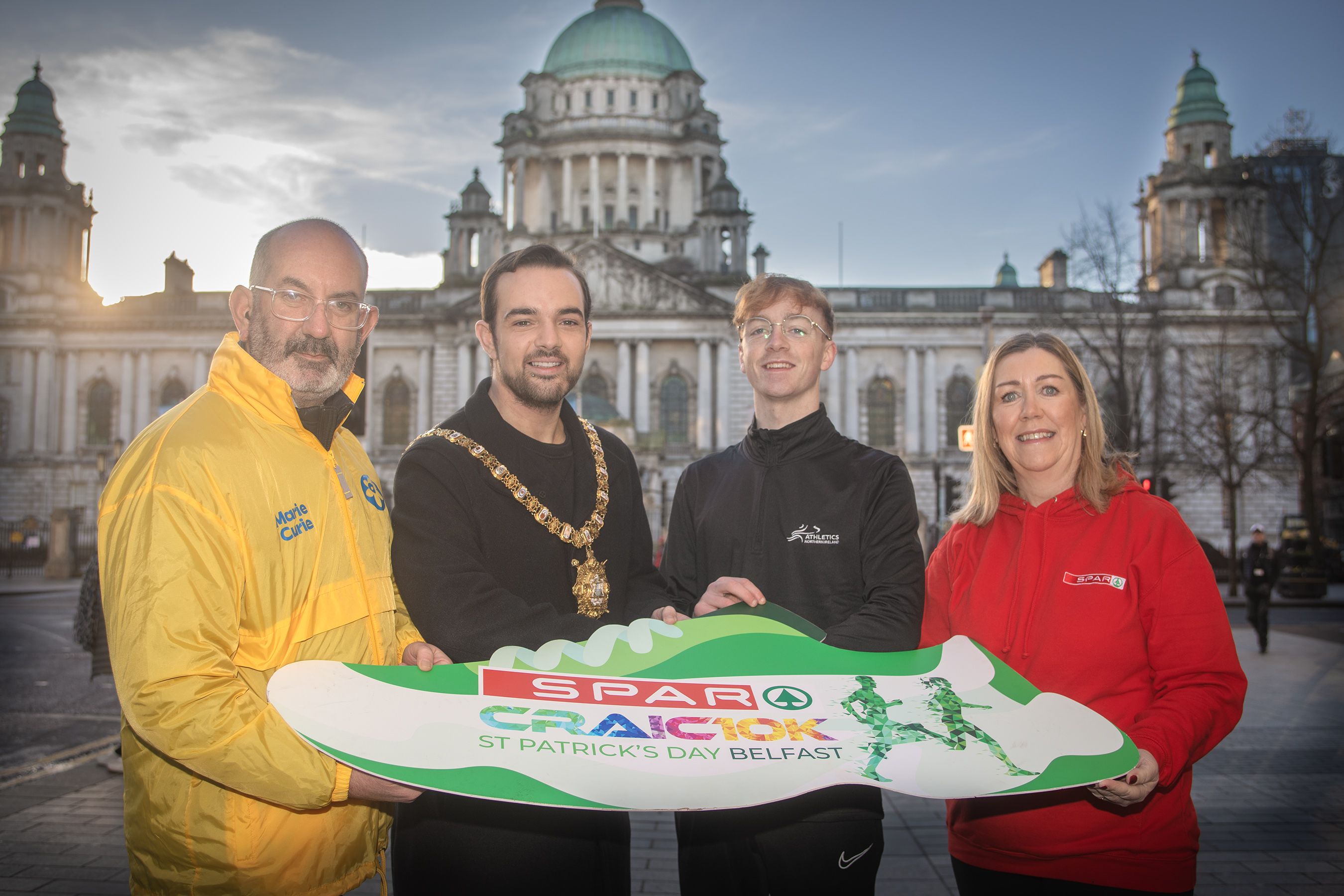 Bronagh Luke, Henderson Group (right), with Oran Young, Athletics Northern Ireland; Conor O’Kane, Marie Curie and Cllr Micky Murray, Lord Mayor of Belfast