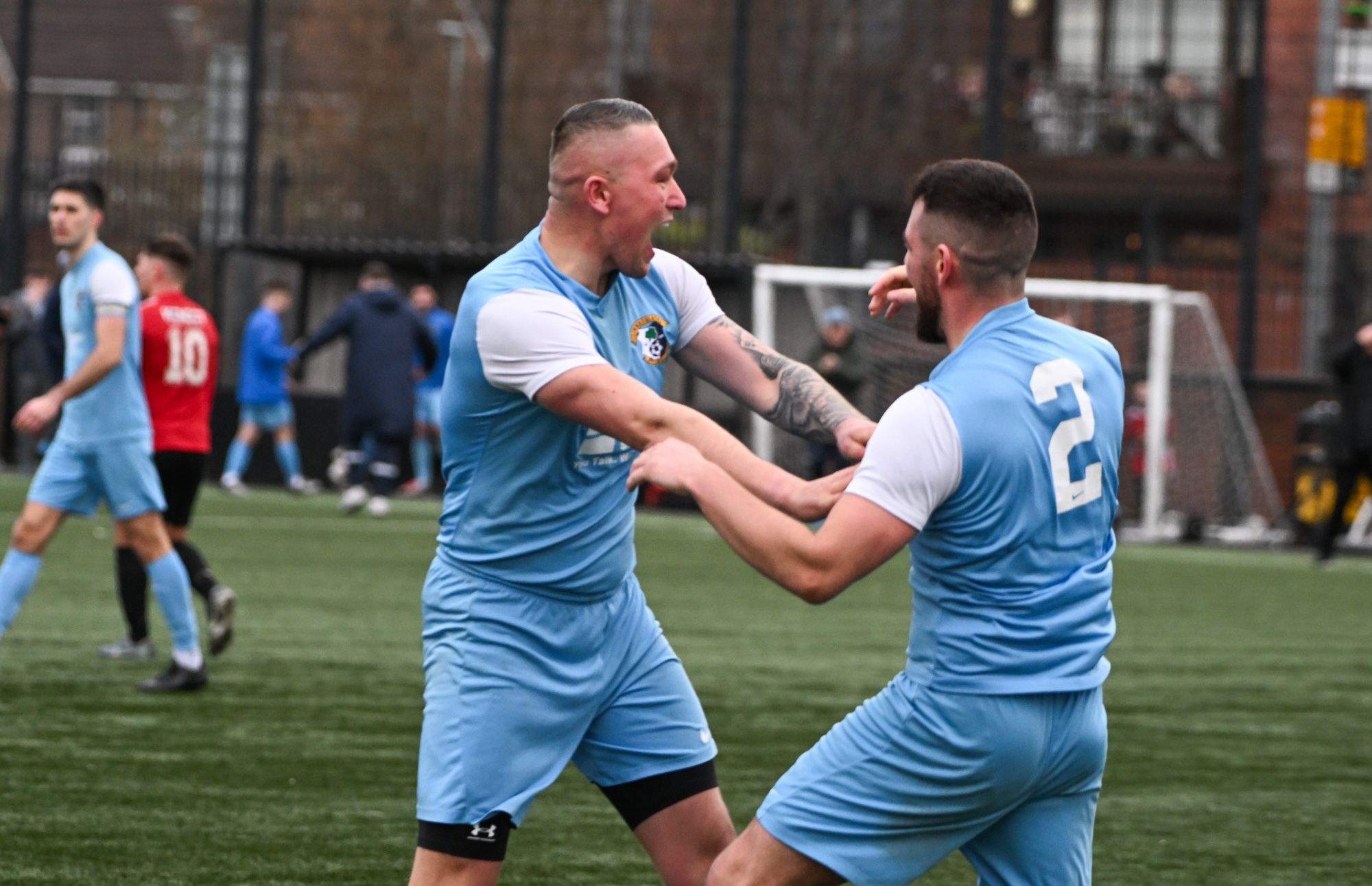 Mark Sloan celebrates with Michael Mervyn after nodding home the equaliser on Saturday 