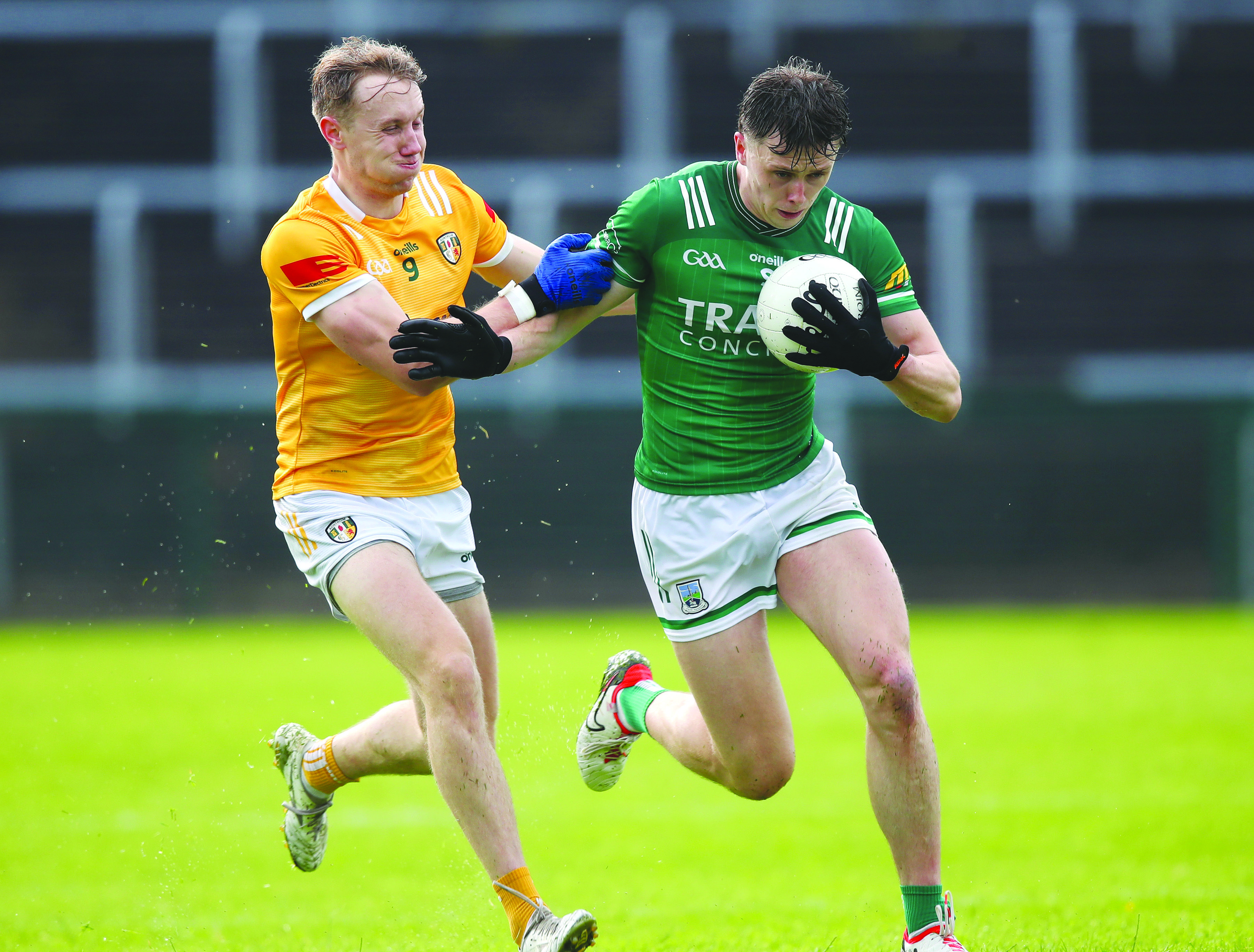 Cathal Hynds - one of a number of Antrim players on the injury list - challenges Joe McDade during the Saffrons’ stunning comeback win over Fermanagh in the Tailteann Cup last year