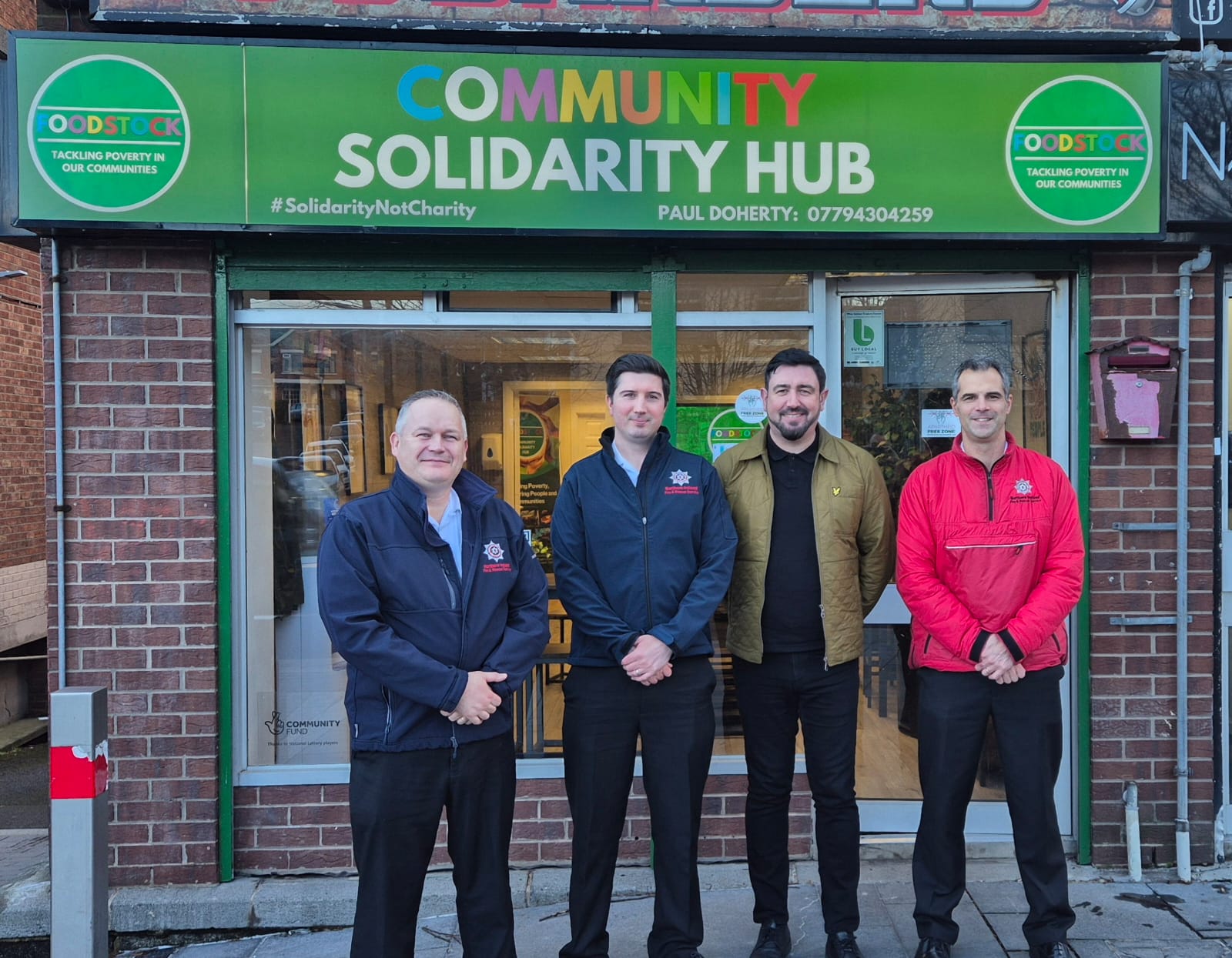 SUPPORT: SDLP councillor Paul Doherty with members of the Fire Service