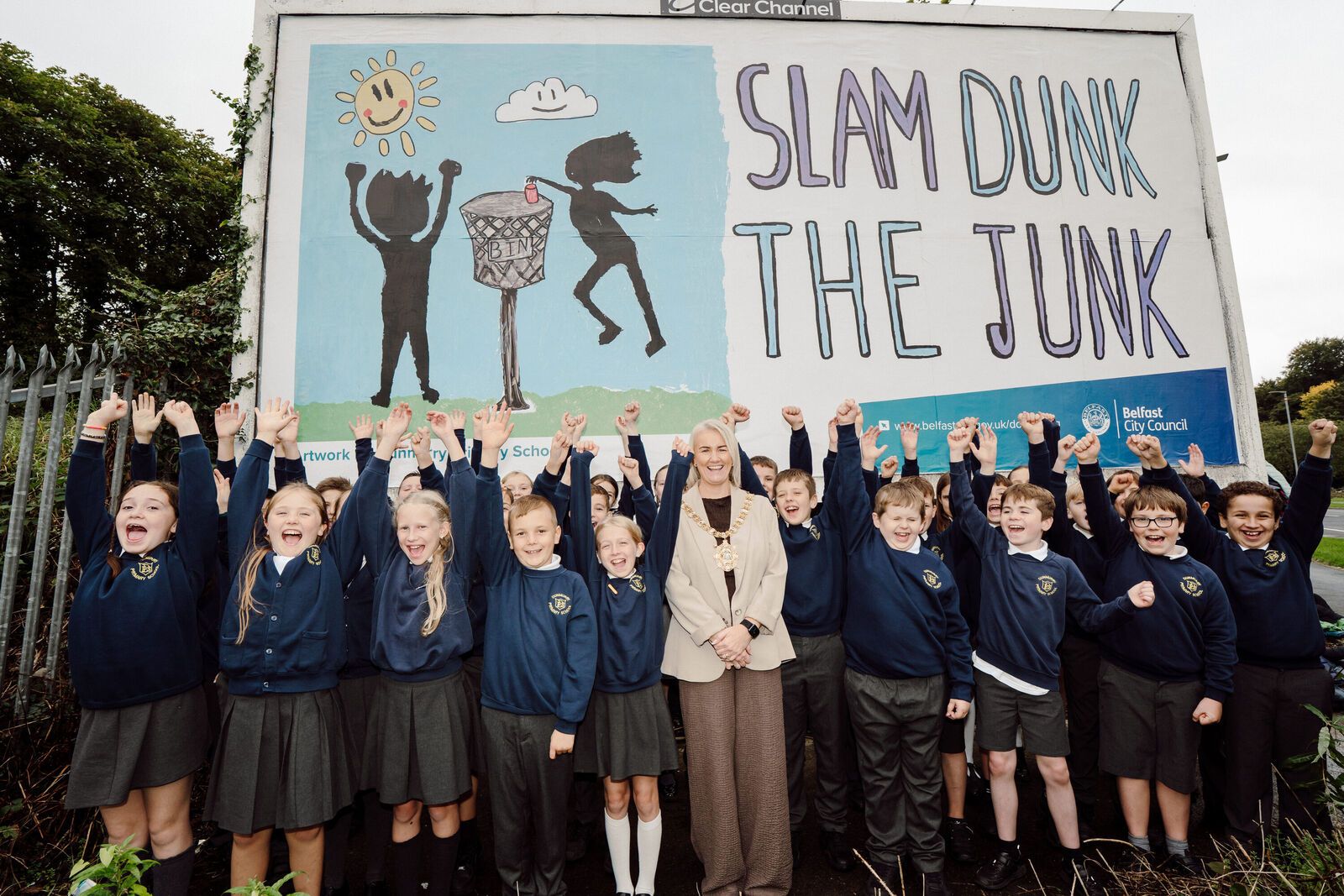 Pupils from Dunmurry Primary School in front of their winning billboard with Lord Mayor of Belfast, Councillor Tracy Kelly. 