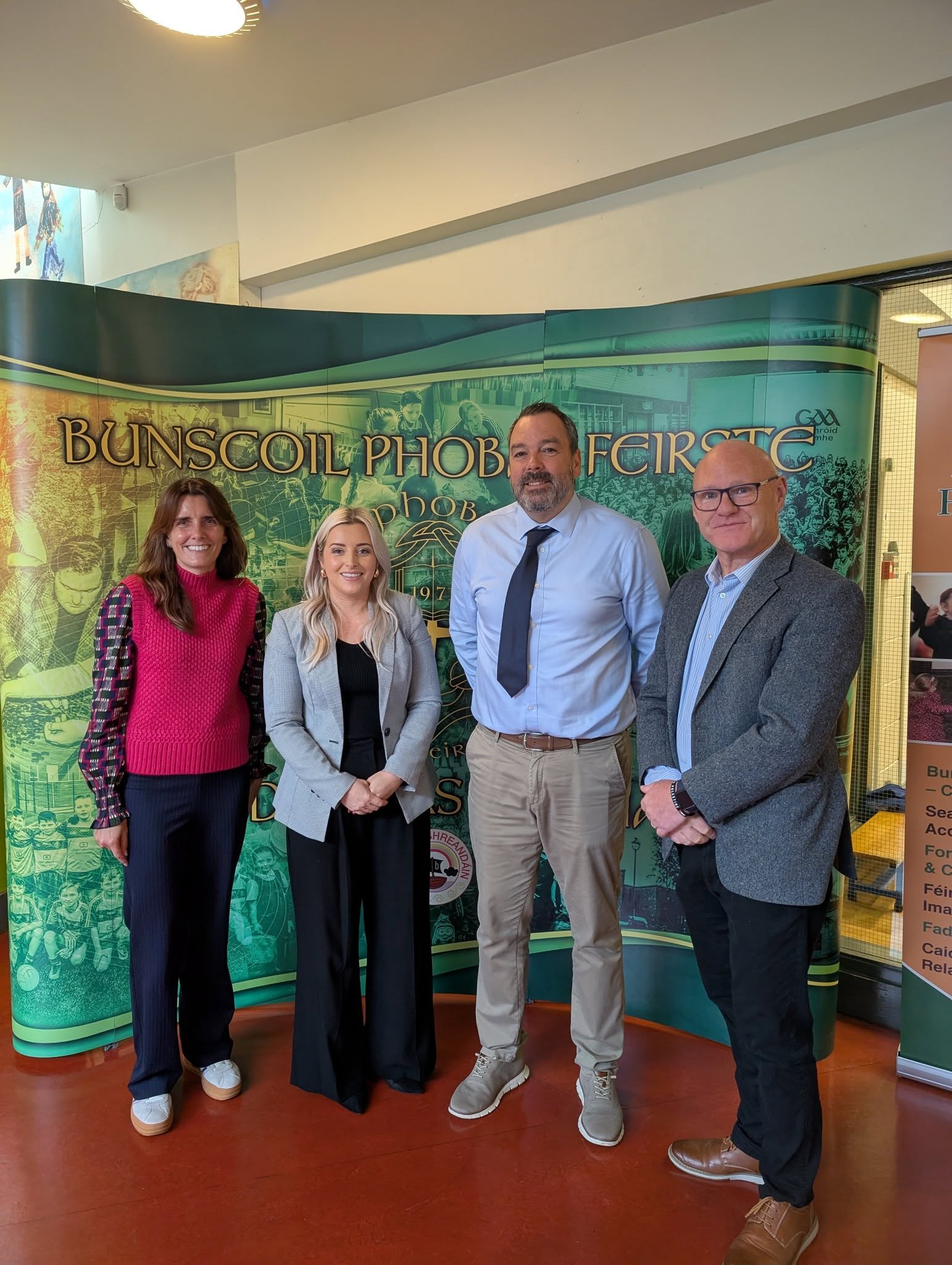 WELCOMED: Debbie Mingout (Department of Education), Órlaithí Flynn MLA, Bunscoil Phobail Feirste Principal Séamus Ó Tuama and Paul Maskey MP