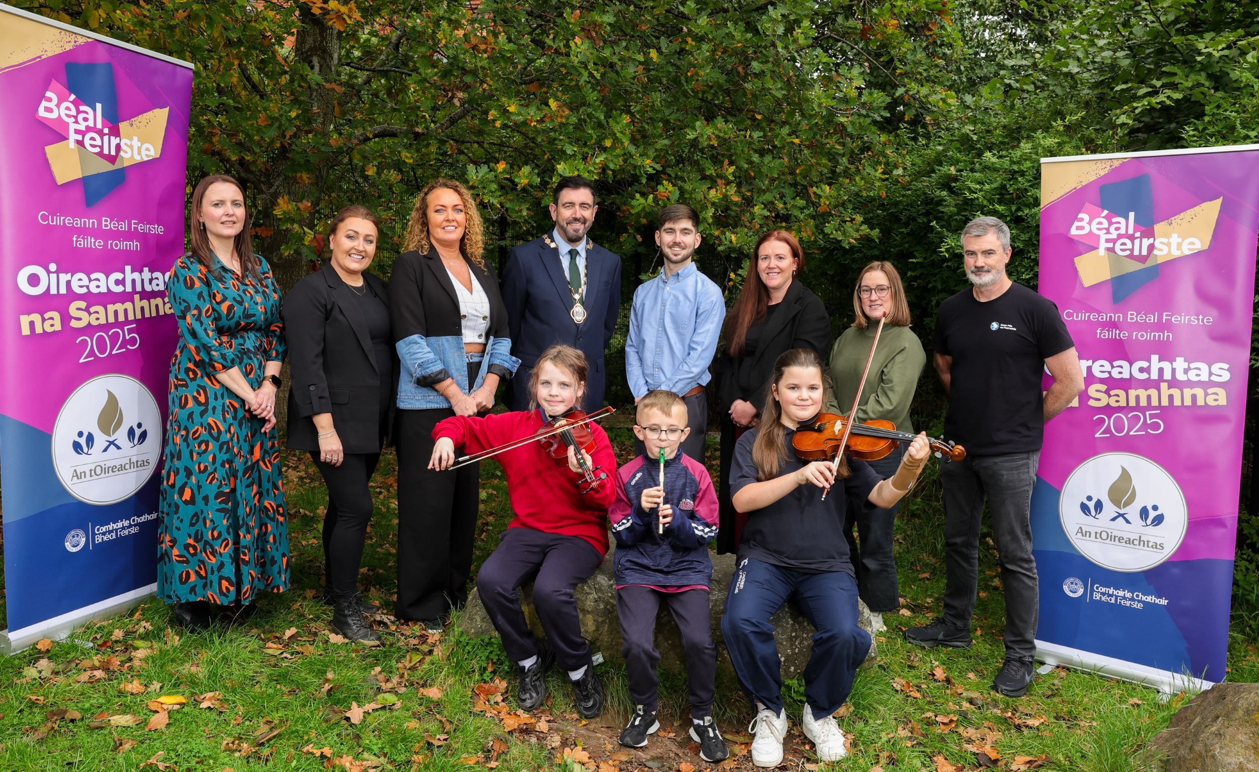 MAITH SIBH: Deputy Lord Mayor of Belfast, Councillor Paul Doherty, and representatives from An Droichead, Cumann Cultúrtha Mhic Reachtain, Fís an Phobail and Foras na Gaeilge, enjoy  music from Scoil an Droichead pupils