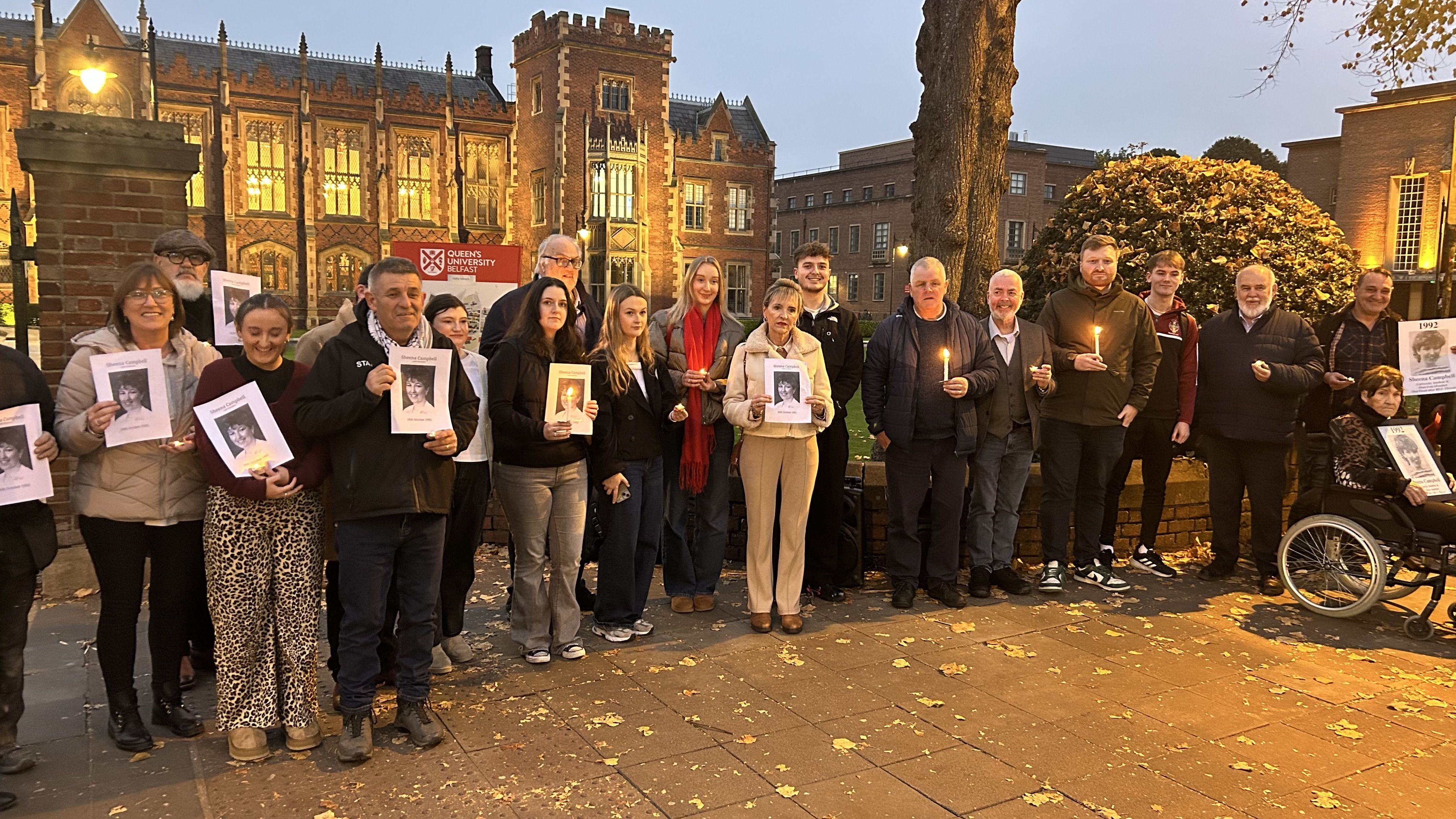 PLAQUE PLEA: Students and former colleagues of Sheena Campbell joined her mother Jean \'Queenie\' Fegan (in wheelchair)  for a vigil at at the gates of Queen\'s University Belfast to mark the 33rd anniversary of the killing of Sheena Campbell on 16 October