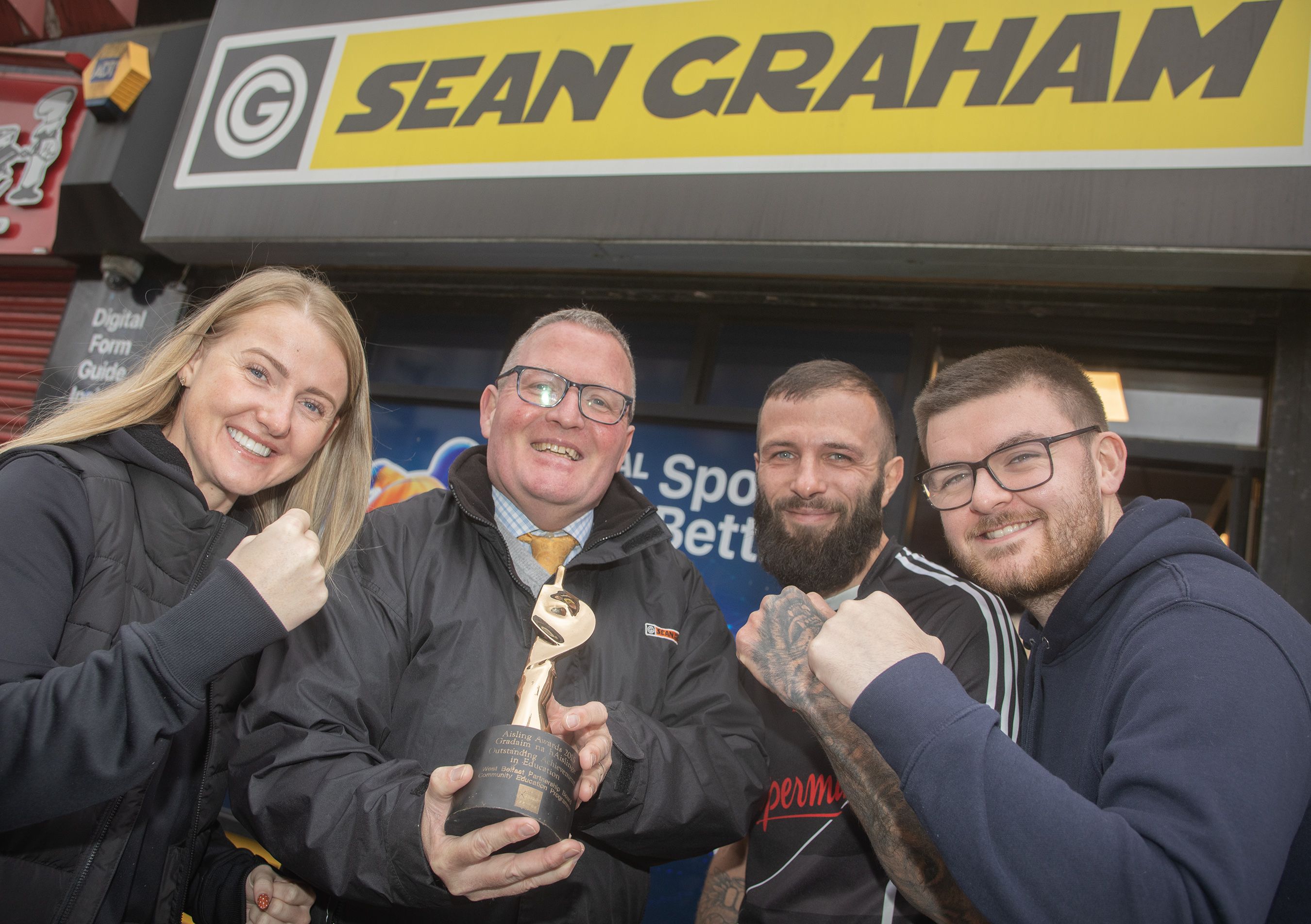 IN THE FIGHT: Brian Graham from sponsors Sean Graham with last year’s winner Anthony Cacace, Amy Dickinson from Aisling Events and sports reporter Maghnus Dunne
