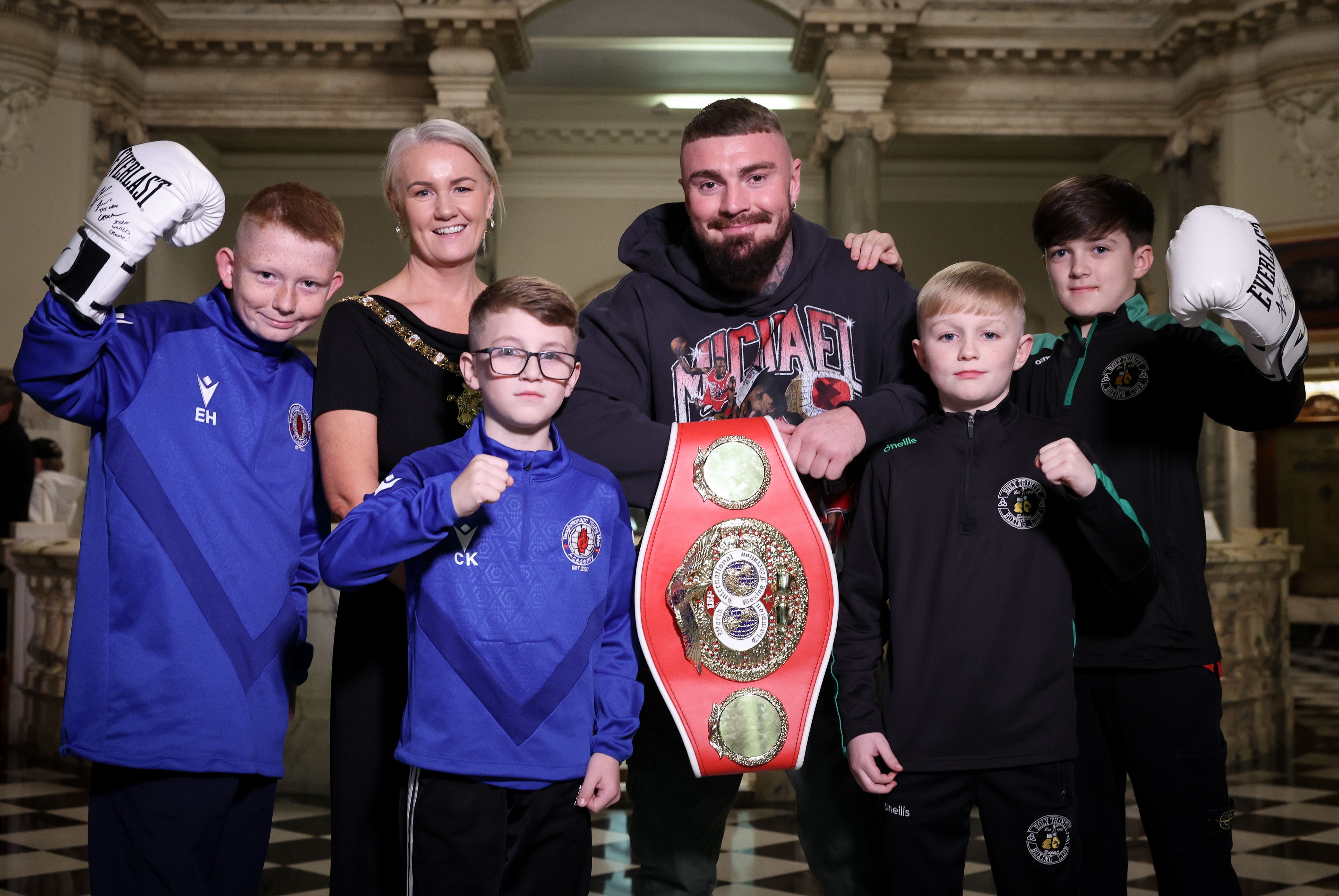 INSPIRE: Young boxers Ethan Hoy and Charlie Kidd (Taughmonagh Young Men\'s Academy) and Sean McGarry and Cayden Collins (Holy Trinity Boxing Club) join Lord Mayor of Belfast, Councillor Tracy Kelly,  and IBF World Welterweight Champion Lewis Crocker