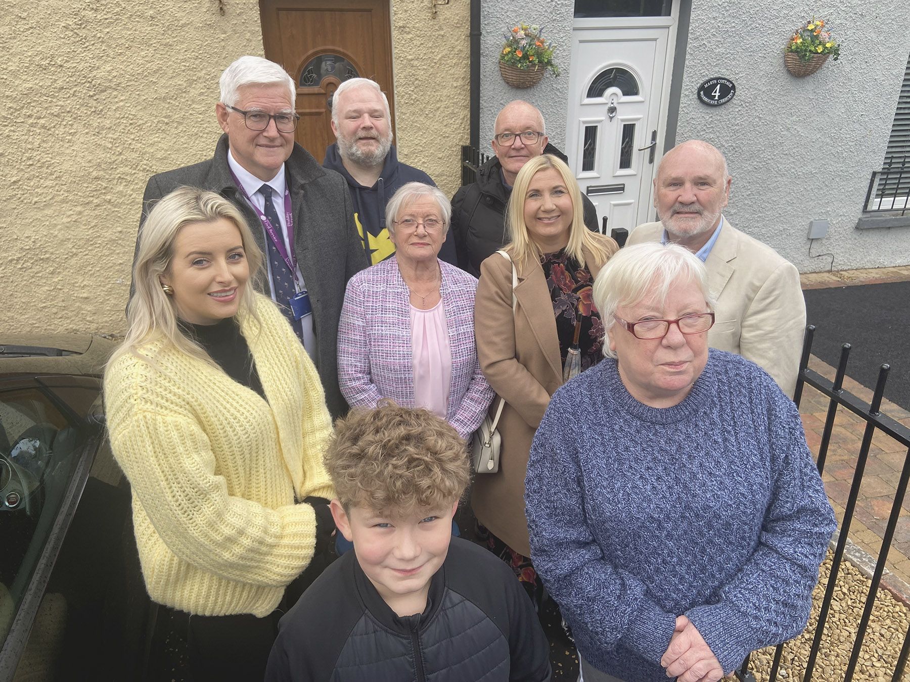REDEVELOPMENT: Colum Boyle, DfC Permanent Secretary, with Orlaithi Flynn MLA, local residents and members of Lenadoon Community Forum at Woodbourne Crescent