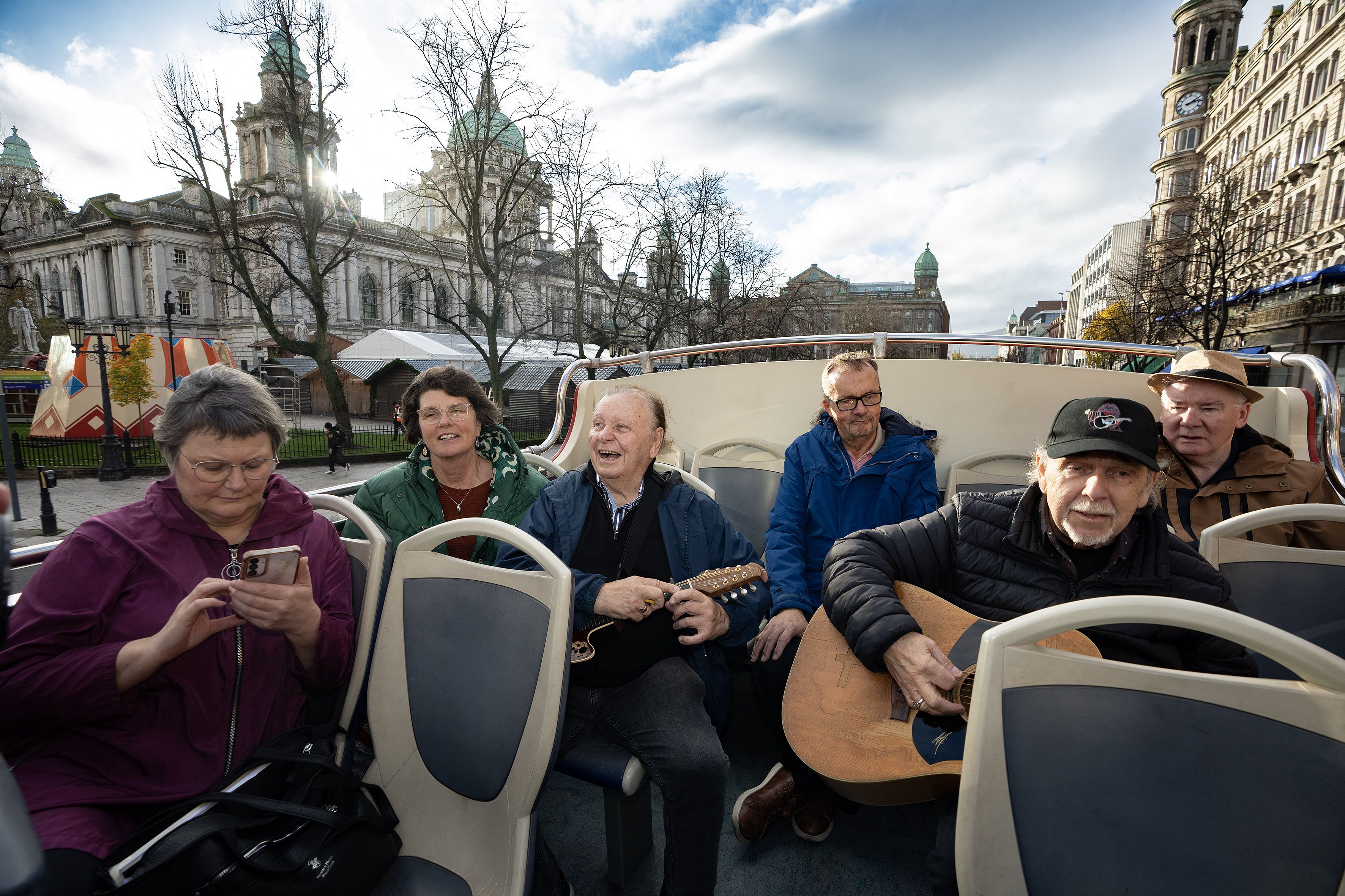 FAREWELL: Music fans going Eddie and George Furey on the top deck for a bus tour of Belfast