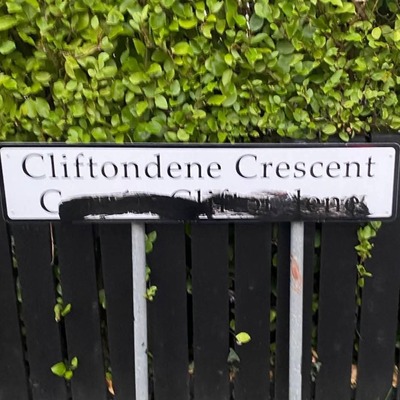 Vandalism to Irish signage is in contrast to Oireachtas celebrations in city