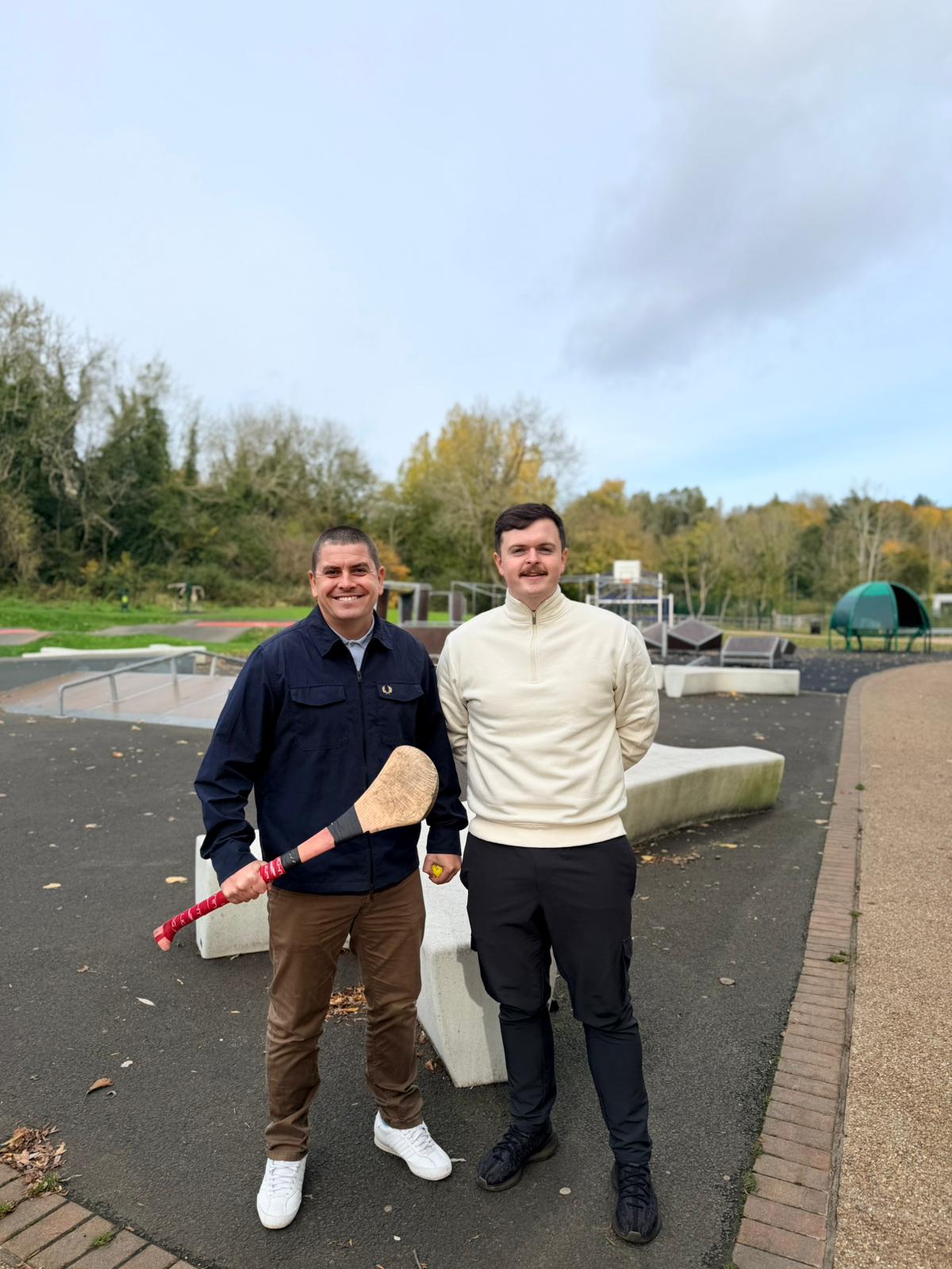 INVESTMENT: Sinn Féin Councillor Caoimhín McCann and West Belfast MLA Danny Baker practice their hurling skills