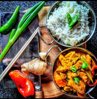 PLATING UP: Chicken curry and rice with homemade flat bread