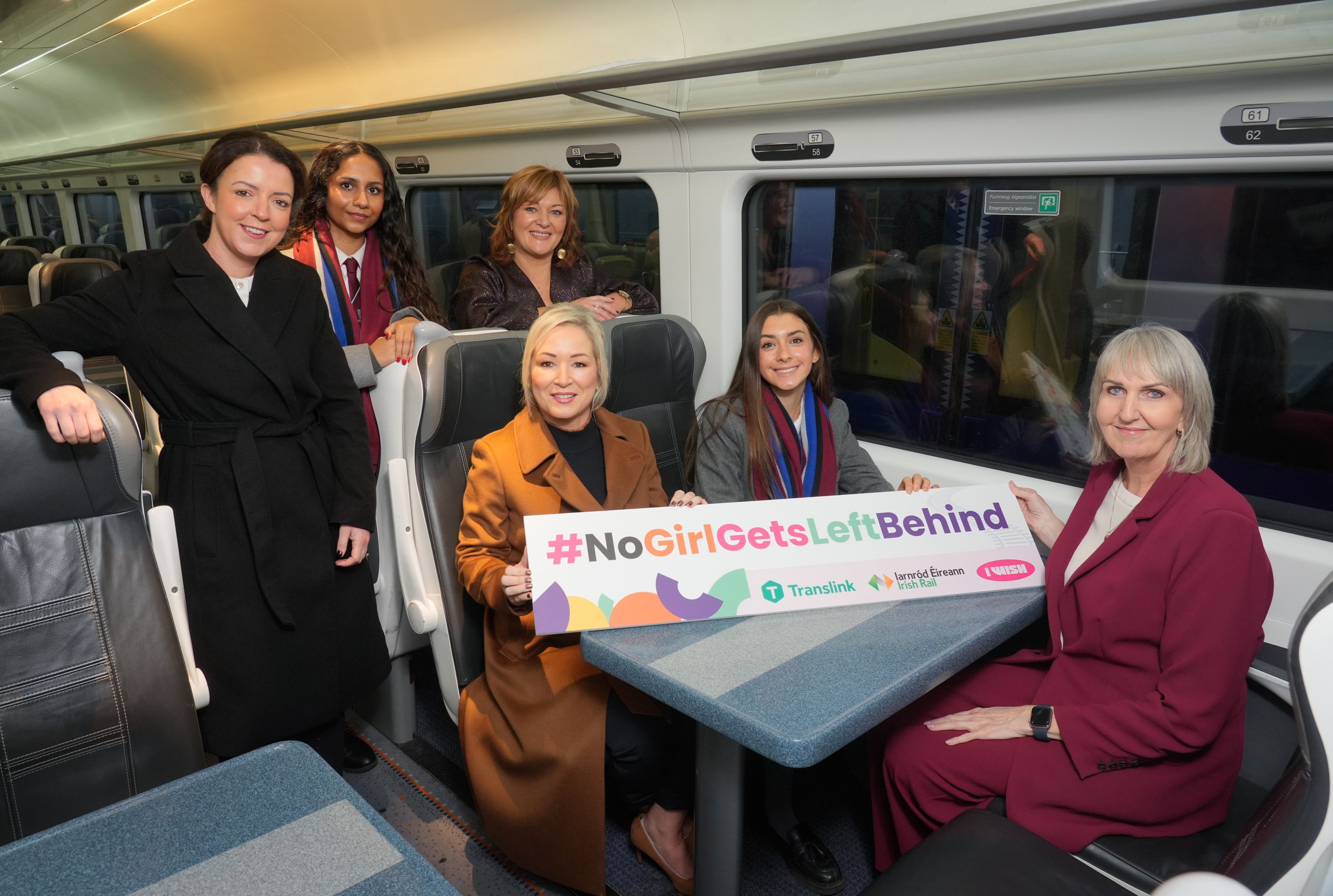 ALL ABOARD: Minister for Infrastructure, Liz Kimmins; iWish Director, Sharon Lombard; First Minister, Michelle O\'Neill; Translink\'s Jacqui Kennedy; and Victoria College pupils Summer Robertson and Sanskruti Gangoda