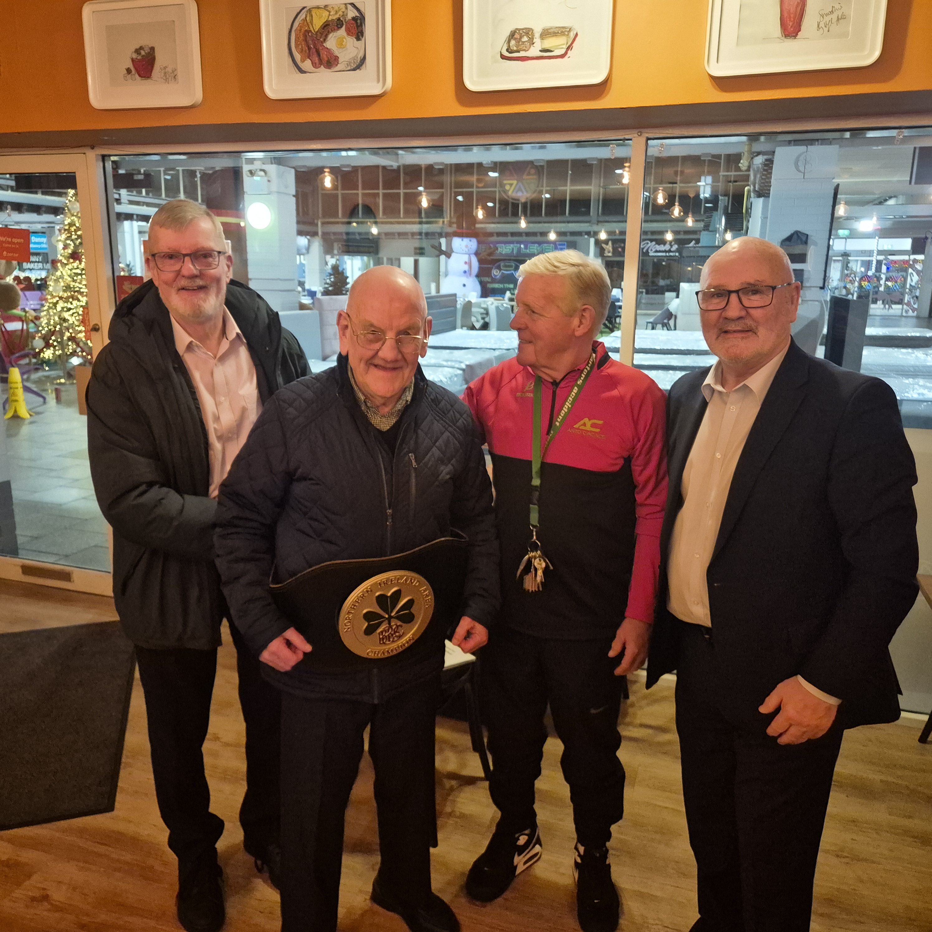 RE-UNITED: Jim McAuley with his belt alongside John Gray, Micky Hawkins and Alex Maskey