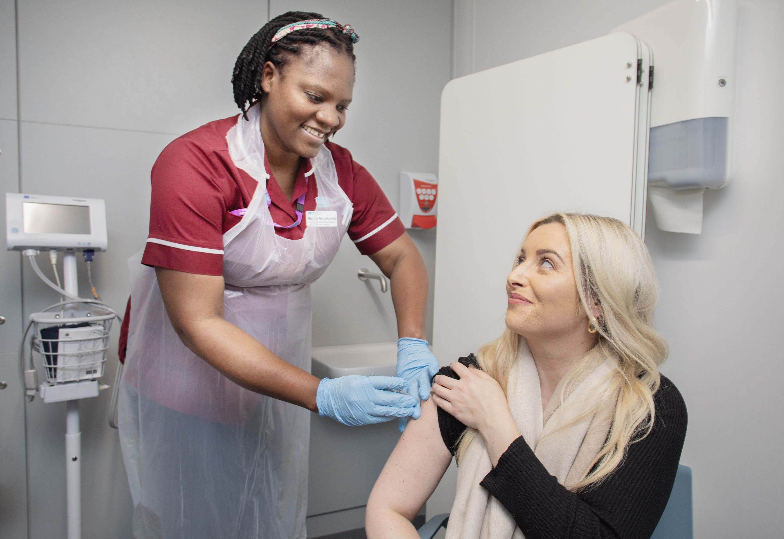 IN GOOD HANDS: Órlaithi Flynn MLA receives her flu jab from Martina Mountcastle