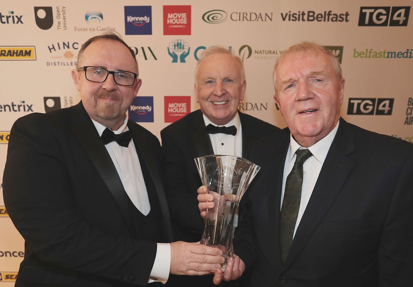 COMMUNITY BUILDING AWARD: Jim Black and Patrick Devlin from winners St Matthew's Housing Association with Michael McAdam from sponsors Movie House Cinemas